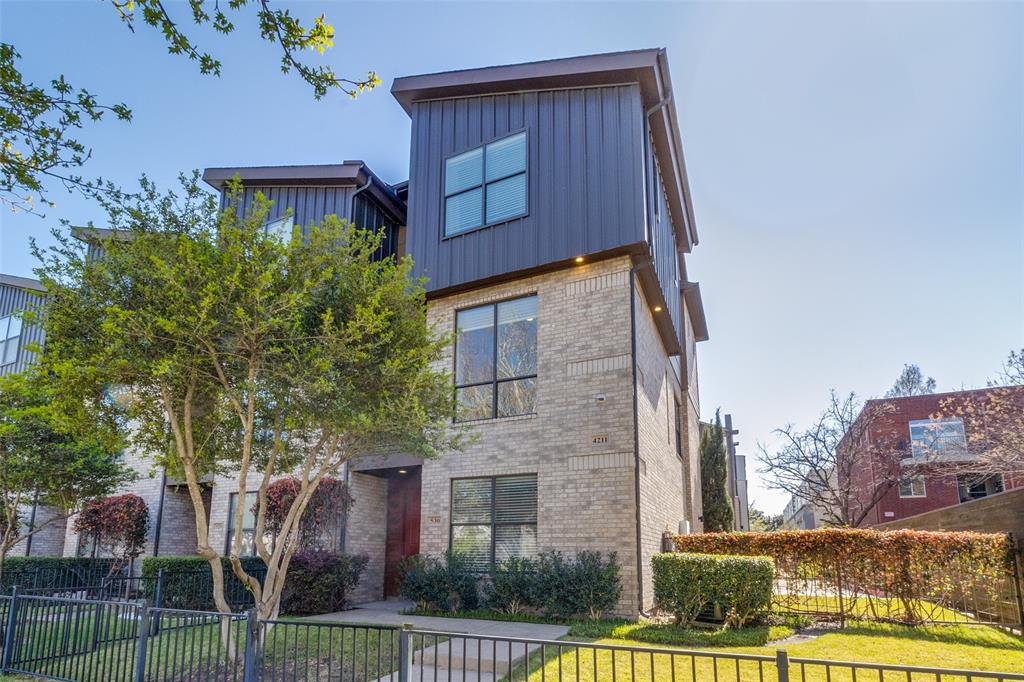 Stunning end-unit townhome in the heart of Oak Lawn, ideally located just minutes from the Katy Trail, Uptown, Downtown Dallas, the Medical District, Design District, and some of the city's best dining, shopping, and nightlife. Offering exceptional natural light with additional windows throughout and one of the most desirable locations in the community, this beautifully updated 2-bedroom plus study residence combines modern luxury with a highly sought-after lock-and-leave lifestyle.

The largest gated front yard in the complex provides an ideal private outdoor space for entertaining, pets, or everyday enjoyment. The first-floor bedroom features hardwood floors and an updated ensuite bath, offering flexibility for guests, a roommate, or a dedicated home office.

Designed for both comfortable living and entertaining, the open-concept second level showcases a gas fireplace, private balcony, abundant natural light, and a timeless kitchen complete with granite countertops, a large island, white cabinetry, and stainless steel appliances, including a gas range.

The third floor is dedicated to a built-in Ligne Roset study and an oversized primary retreat featuring multiple closets and a fully renovated spa-inspired bath with a Victoria + Albert volcanic limestone soaking tub, Porcelanosa tile, Toto toilet, oversized shower, floating cabinetry with quartz countertops, and Robern AiO lighted medicine cabinets.

Additional upgrades include fresh paint, a Navien tankless water heater, curated designer lighting by Santa & Cole, Jonathan Adler and VIPP, Hansgrohe fixtures throughout, and a recently replaced roof (2024). Located in one of the few Oak Lawn communities with a pool and outdoor grilling area, this exceptional residence offers luxury finishes, private outdoor living, and unmatched access to some of Dallas' most desirable destinations.