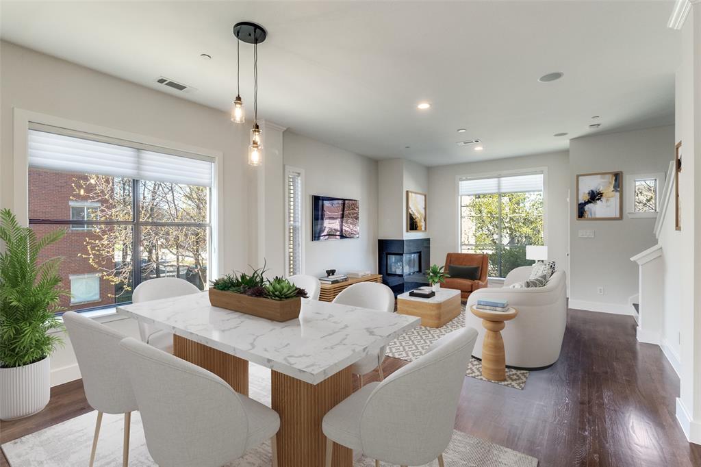 Stunning end-unit townhome in the heart of Oak Lawn, ideally located just minutes from the Katy Trail, Uptown, Downtown Dallas, the Medical District, Design District, and some of the city's best dining, shopping, and nightlife. Offering exceptional natural light with additional windows throughout and one of the most desirable locations in the community, this beautifully updated 2-bedroom plus study residence combines modern luxury with a highly sought-after lock-and-leave lifestyle.

The largest gated front yard in the complex provides an ideal private outdoor space for entertaining, pets, or everyday enjoyment. The first-floor bedroom features hardwood floors and an updated ensuite bath, offering flexibility for guests, a roommate, or a dedicated home office.

Designed for both comfortable living and entertaining, the open-concept second level showcases a gas fireplace, private balcony, abundant natural light, and a timeless kitchen complete with granite countertops, a large island, white cabinetry, and stainless steel appliances, including a gas range.

The third floor is dedicated to a built-in Ligne Roset study and an oversized primary retreat featuring multiple closets and a fully renovated spa-inspired bath with a Victoria + Albert volcanic limestone soaking tub, Porcelanosa tile, Toto toilet, oversized shower, floating cabinetry with quartz countertops, and Robern AiO lighted medicine cabinets.

Additional upgrades include fresh paint, a Navien tankless water heater, curated designer lighting by Santa & Cole, Jonathan Adler and VIPP, Hansgrohe fixtures throughout, and a recently replaced roof (2024). Located in one of the few Oak Lawn communities with a pool and outdoor grilling area, this exceptional residence offers luxury finishes, private outdoor living, and unmatched access to some of Dallas' most desirable destinations.