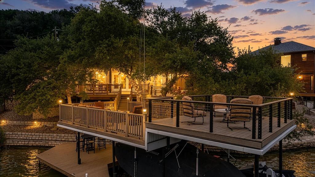 Don't miss this extraordinary 4 bedroom, 2.5 bath home on main body water--sitting on one of the most desirable parts of Lake Granbury! Fourth bedroom could be utilized as an office, if needed. Home has been lovingly maintained, with beautiful updates. Multiple outdoor living and seating areas, nestled within a canopy of trees, lead to a large multi level boat dock and sunning platforms. Dock can accommodate a large boat, with slip for jet ski. Stone patios and composite decking require minimal maintenance. This home would be a perfect primary residence, vacation home, or investment property. NO HOA and very little upkeep maintenance required! Pride in ownership is evident. New Class 4 Hail resistant roof installed October 2024. Washer and dryer, refrigerator, bar stools and bunk beds convey to new owner with acceptable offer. Don't miss the summer lake season! Buyer to verify square footage and school assignments.