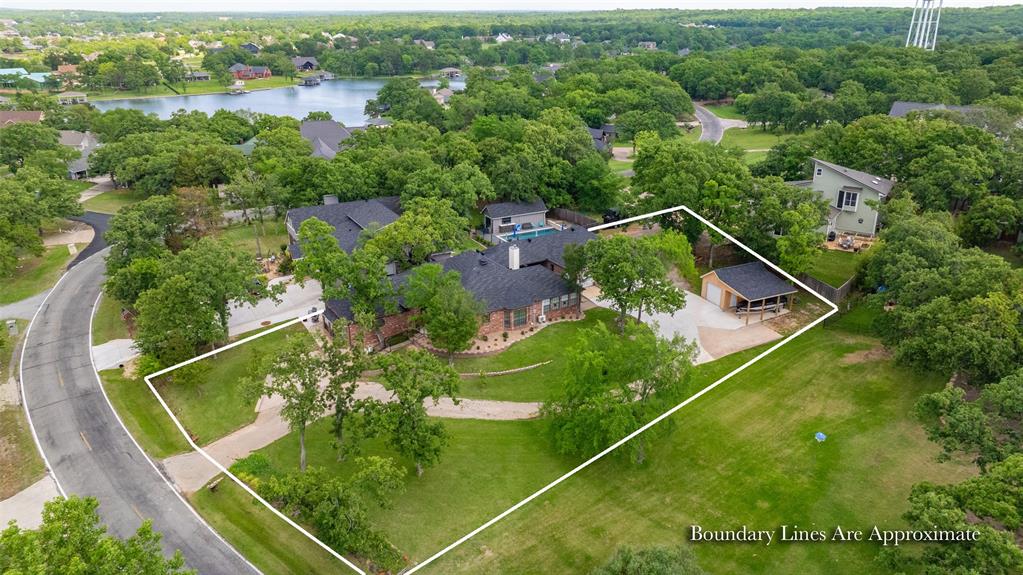 Experience the perfect blend of elegance and the ultimate recreation retreat in this beautifully updated brick home, nestled on a lush 0.5+ acre lot. The exceptional living spaces feature 4 spacious bedrooms and 3 beautiful bathrooms; including a private mother-in-law suite with a private entrance-perfect for guests or multi-generational living. The gourmet kitchen is completely updated with sleek quartz countertops, refreshed cabinets, premium appliances, a pantry, and a breakfast nook in addition to a formal dining room. Enjoy the views from the bright sunroom or relax by the cozy living room fireplace featuring a high-efficiency heater insert capable of warming the entire home. Elegant wood floors flow through the main living areas, solid core doors have been added, and custom features abound: tall baseboards, crown molding, and a custom closet design in the primary bedroom closet. Premium Upgrades and Efficiency: This home has been meticulously maintained with significant improvements. Energy Efficiency! 22 double-pane UV glass windows have been recently installed. A Class 4 impact-resistant roof (offering potential insurance savings) and gutters equipped with leaf guards are incredible upgrades. The exterior features a charming covered porch with a wrought iron gate, beautiful landscaping, and a side patio courtyard with fencing to keep pets safe. Abundant parking options including 4 garage spaces; including a stand-alone garage (shop) with an attached side carport. Lake Kiowa offers unbeatable lifestyle amenities. Located conveniently near both the front and east gates, you are seconds away from the best of Lake Kiowa POA living: Play on the 18-hole PGA-rated course (included in POA dues). Enjoy access to the gorgeous private lake, public boat ramp, an amazing Lodge & restaurant, jogging & walking paths, pickleball, tennis courts, and playgrounds. Enjoy the community garden and the safety of a 24 hour gated environment. Call to book your private showing today!