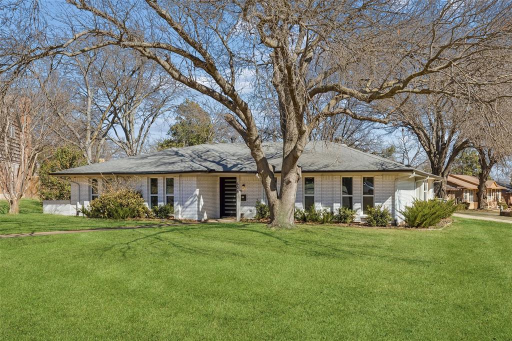 Tucked away on a quiet cul-de-sac in desirable Glen Oaks, this beautifully updated ranch sits on a rare .3-acre corner lot, framed by mature shade trees. Inside, a wide-open floor plan blends formal and informal living spaces, creating effortless flow for entertaining and everyday life. Natural light streams through updated low-E windows, illuminating light wood floors and a statement fireplace that anchors the living area. The eat-in kitchen is the heart of the home, featuring designer glass subway tile, under-cabinet lighting, stainless steel appliances, a gas range, two-tone cabinetry, and a bright breakfast area. The oversized primary suite offers space for a sitting area and a spacious ensuite bath with double vanities and two large walk-in closets. Enjoy year-round relaxation on the screened-in patio overlooking the lush backyard. With abundant storage, a large utility room, and a garage-adjacent flex space perfect for a workshop or gym, this Glen Oaks gem truly has it all.