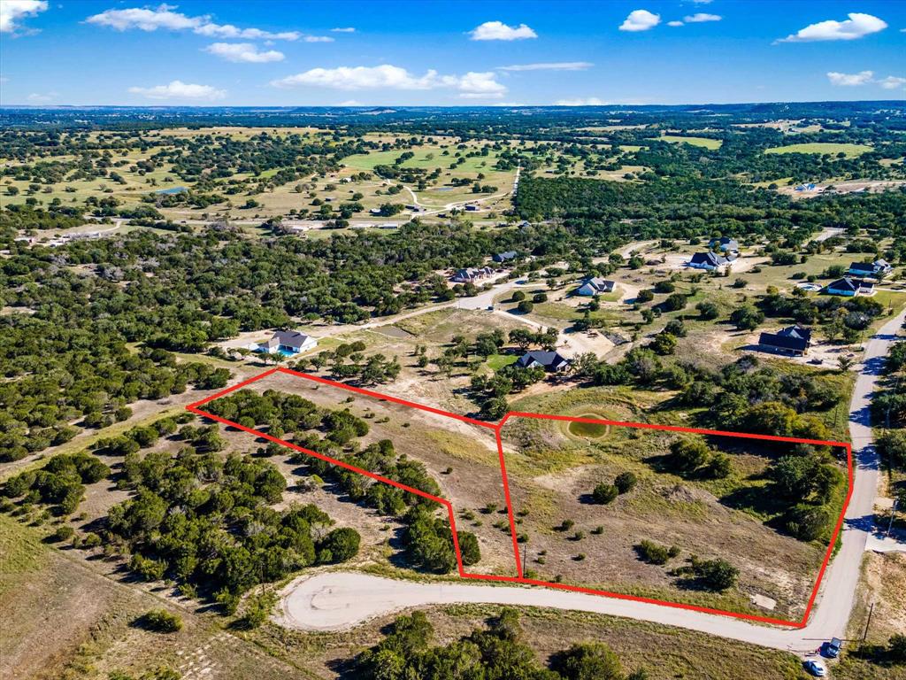 Build your new home in FOSSIL TRAILS ADDITION just west of Glen Rose!  Water lines and electric lines are nearby and just need you to pick your building spot!  This listing contains 5.755 acres & consists of the two adjacent lots 18 & 19.  The majority of the pond at the back of Lot 19 falls within this lot!  Great elevation changes get you the views you've been searching for!  It's located just minutes from Glen Rose near medical facilities, shopping and the great GRISD schools!  Need more acreage?  Don't need that much acreage?  See MLS#'s 20819645 & 20820752 to buy one of these lots individually! You'll love these home sites, the surrounding upscale homes, and the awesome residents of Glen Rose & Somervell County! Enjoy the lower tax rates for this area, and NO city taxes! These lots are more secluded as they're at the very back of the subdivision away from highway noise and with less traffic. Come for a visit! ***ALL PENCILED-IN PROPERTY LINES ARE APPROXIMATE***