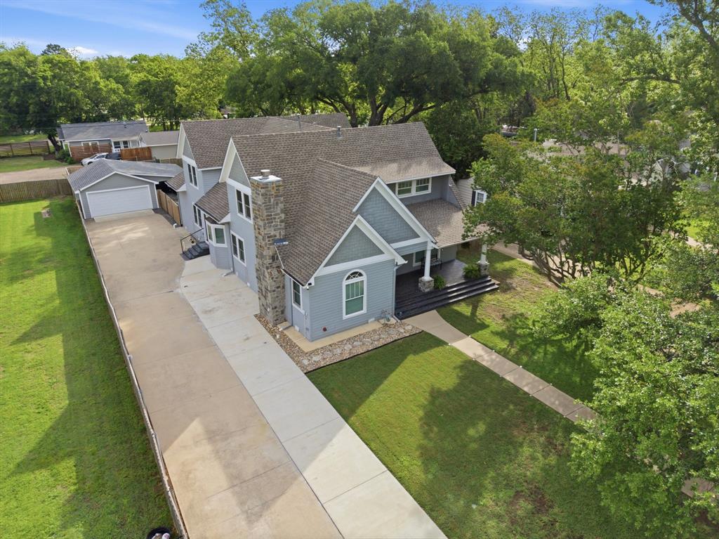 Set on one of Terrell’s most iconic streets, this exceptional residence captures perfect balance of historic charm and modern livability. Rebuilt from the studs in 2015, this home offers the character of an early 1900s property paired with the efficiency and reliability. Major systems including electrical, plumbing, foundation, framing, HVAC, and insulation were replaced. Recent improvements include a new roof, extended driveway, French drains, added lighting and ventilation beneath the home, new windows and doors, along with an expanded outdoor patio and concrete slab. Inside, the home features 4 spacious bedrooms, 4 full bathrooms with high end finishes, hardwood flooring runs throughout with no carpet, complemented by custom cabinetry, and crown molding through out. The kitchen is thoughtfully designed for both everyday living and entertaining, featuring an oversized island, secondary island, farm sink, and walk-in pantry. Appliances include two dishwashers, a Miele combi oven, steamer oven, Viking 8-burner gas range, and an additional Electrolux French door refrigerator and freezer in the pantry. The first floor offers a dedicated office or optional 5th bedroom, formal dining, and both formal and family living areas. The formal living room is anchored by a statement fireplace, creating a warm and inviting focal point. The primary suite serves as a private retreat with an ensuite bath, sitting area, and direct outdoor access. Upstairs includes a second primary suite, large game room with beverage station, additional bedrooms, walk in closets for every bedroom and a versatile bonus room ideal for an office or craft space, along with ample climate-controlled storage. Situated on a .39-acre lot with mature trees, the fully fenced backyard features covered patios, an expanded concrete pad offering space to relax, entertain, and enjoy. Homes offering this level of space, thoughtful updates, and timeless character are rarely available in Terrell.