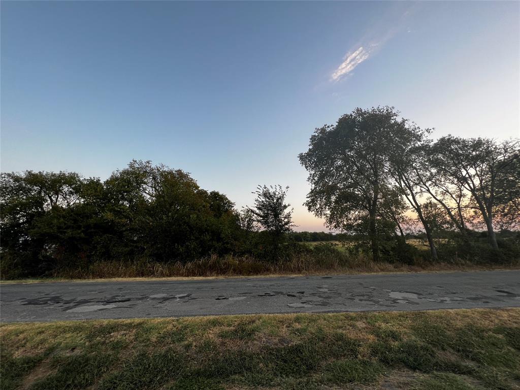 5.4 acres total across two parcel id's.  118' wide access to paved road, the front .6 acres portion is in city limits and provides access to the 4.8 acre county property at the back.  You have large mature trees providing privacy for your homesite or workshop location.  This property is priced below market value due to proximity to Cole Correctional Unit across the road.  You have options to build or place a mobile home on this property.  Verify with the county about your options to build your commercial business location here.  Your access is from a paved road and almost 119' feet wide.  The property goes back 552' to wear it opens up to a rectangle 403' wide and 344' deep all in the county.  Lot's of options at a great price.