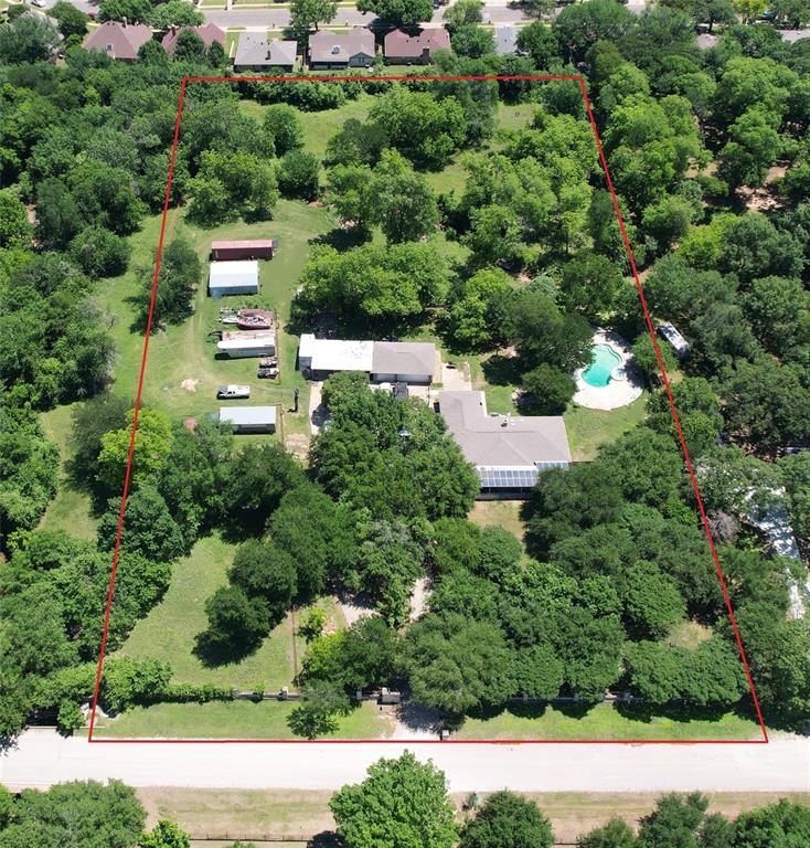 Rural living on 4.63 ACRES in the heart of the DFW metroplex! This rare find in Southwest Arlington is equidistant to Arlington’s entertainment district & to downtown Ft Worth with just a 20 minute drive to either destination via commuter highways TX 287 & Interstate 20. This is the largest piece of contiguous acreage owned by a single party within the Hidden Oaks Addition. This 2,320 SF one owner home offers 3 bedrooms, 2 baths, a 12 Ft deep pool with hot tub, detached 3 car garage with automatic doors & multiple out buildings suitable for a variety of uses such as dry storage, extra carports, private workshop, equestrian facilities or livestock pens with the appropriate ag exemption which saves thousands of dollars on annual property taxes. Consists of two individually platted parcels, 5313 & 5309 Hidden Oaks Ln. Wrought iron gate with Austin stone pillars spanning 303 Ft of road frontage along a cul de sac street invites you into a secluded oasis lined with mature trees, lush grass & your own private creek. Large Western facing covered front patio, spanning the entire width of the house, is set back 135 Ft from main entrance to alleviate road noise. Poured concrete driveway lined with mature live oaks allows a full 180 degree turnaround, ideal for staging vehicles or heavy equipment. This is your opportunity to own a slice of serenity that feels like a rural homestead just 13 miles away from downtown Fort Worth. Interior of the house is unfinished, ready for your custom renovation plans. Cost effective solar panels are owned free & clear & will convey with the sale. This is an AS-IS offering!! Buyer to confirm accuracy of all due diligence materials prior to closing and funding. No HOA. Located within FEMA’s special flood hazard zone AE. Copies of Survey, FEMA & zoning maps & general filing information regarding Tarrant County Ag Exemptions are available in TransactionDesk