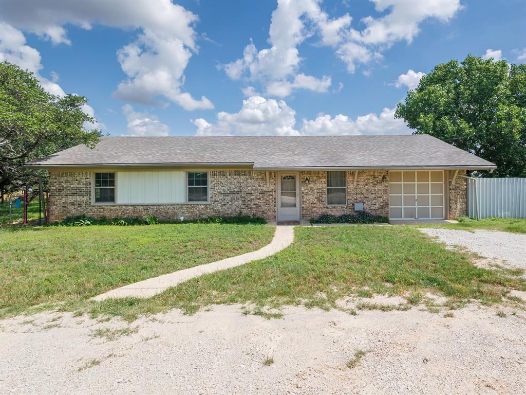 This home, just minutes from the beautiful Lake Brownwood, has a great combination of indoor functionality and a beautiful outdoor oases with trees and trails; perfect for family, pets, or simply relaxing in the privacy of the back yard with a morning coffee on the back porch! The interior was remodeled just a few years ago, to include all new windows. All current appliances are included. This house is located just minutes from the convenience of local stores, but also on a quiet road away from the bustle of traffic. Whether you're looking for a full time home, a weekend retreat, or a rental, this home is definitely worth investigating. Call the listing agent today for your private tour and let discuss how we can make this little gem your next adventure!
