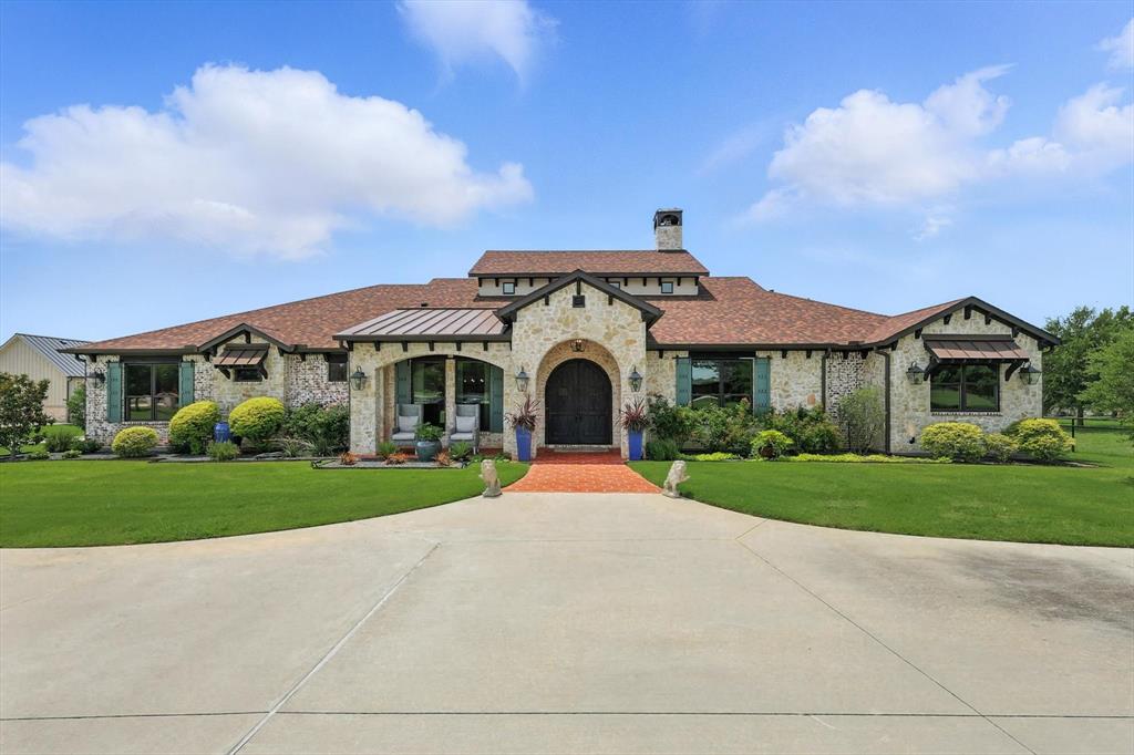 FIT FOR A KING! Welcome to this prime location at 220 Kings Road in Double Oak sitting on two acres bordering Flower Mound. Exemplary Flower Mound Schools! This executive, luxurious estate offers high end finish out throughout. The impressive exterior design, landscaping  and circle drive welcome you home! Interior offers impressive stone finishes, 20' retractable pocket glass doors opening to the large covered patio overlooking gorgeous pool&spa with expansive living and entertaining space,  inside boasts high end granite countertops, custom reclaimed wood flooring, barn beams and gorgeous designer lighting throughout.  spacious designer chef's kitchen with 13' oversized island, gas range, built in SS refrigerator, copper farm sink, cooling refrigerated drawers. large pantry and plenty of beautiful cabinetry for storage.  2 primary ensuites on main level plus 2 additional bedrooms w. Jack and Jill bathroom. Primary ensuite offers oversize steam shower, dual vanities, free standing bathtub, 2 walk in closets, one with access to large laundry room for convenience. 440 SF upstairs flex space plus full bathroom for additional bedroom, office or game room. 1800 SF separate living detached flex unit and garage space. Private back yard offers propane fire bowls and pit, cabana, built in grill, refrigerator and automated screens on patio. Smart home capabilities Control 4 system which controls all indoor, outdoor lights, audio and exterior camera. All app accessible and a private closed low voltage power tower. Large circular driveway with additional paved parking and 5 garage spaces make this the perfect forever home! Roof replaced 5-24.