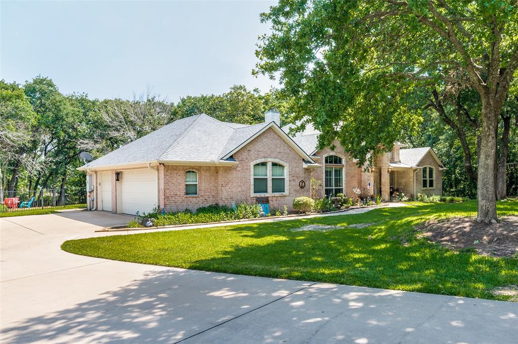 Custom, one-story, 5 bed, 3bath home on an acre of wooded land off of Lake Lewisville. Large kitchen open to dining area, living area, and bonus room make for the perfect spot for entertaining.  Gorgeous views and natural light throughout the home, with custom shutters in main living areas.   Kitchen has an island, bar area, double ovens and large 5 burner stove.   Master bathroom with jetted tub, double sinks and a walk in closet.  Spacious laundry room with plenty of storage and a sink.  Oversized three-car garage with epoxy floors and a sink.  Split floor plan with larger secondary bedrooms and jack and Jill bathroom. RO faucet in the garage ready to plum to an icemaker or use as is.   Great back porch to enjoy the view of the wooded lot and catch a glimpse of the lake and to entertain.  House and garage have fresh, neutral paint and new carpet.  Home is now vacant.
New AC Units in 2020
New Water Heater in 2025
Sprinkler system runs on well water.  Home is on Mustang SUD water.