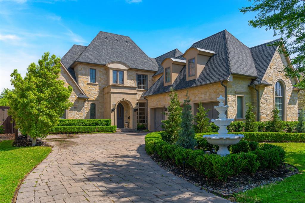 Nestled on a beautifully landscaped lot in the highly sought-after Preston Hollow neighborhood, this exquisite French-style residence boasts unparalleled curb appeal and luxurious living. Downstairs features your primary bedroom and stunning private bathroom, plus a 2nd bedroom with en-suite bathroom. Upstairs are two bedrooms with en-suite bathrooms, and a half bathroom next to the media room. This home offers elegant comfort and thoughtful design throughout. The expansive open-concept layout seamlessly connects the living room to the gourmet kitchen - perfect for entertaining and everyday living. Outfitted with top-of-the-line appliances, a generous eat-in breakfast area, and sophisticated finishes, the kitchen is truly the heart of the home. A wall of windows floods the space with natural light while offering serene views of the lush backyard oasis. Step outside to your private retreat: a beautifully manicured backyard with a stunning covered patio - ideal for outdoor dining or unwinding after a long day. The luxurious cabana house, complete with a full bath, mini-fridge and kitchen sink enhances convenience and elevates your pool side experience. The outdoor wood burning hearth fireplace is the place to go on cooler evenings for outdoor enjoyment. Additional highlights include an upstairs Media room with a wet bar, ice maker, and mini-fridge - perfect for movie nights. A second downstairs wet bar with wine cooler and ice maker are conveniently located near the kitchen, dining and living areas. A library-office room with a grand window that looks outside to the front of home offers natural light when working. Designed for both privacy and entertaining, this exceptional home offers refined style, high-end amenities, and a seamless blend of indoor and outdoor living. It's more than a home - it's a lifestyle. Broker is the Owner.