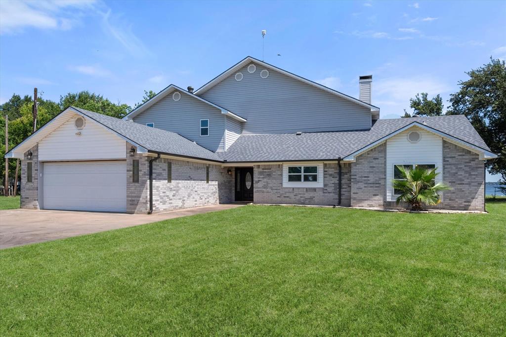 **PRICE ADJUSTMENT**LAKE FRONT VIEWS WITHOUT THE LAKE FRONT PRICE! MEMORIES MADE WITH FRIENDS AND FAMILY AT THIS LAKE HOUSE WILL NEVER END! THE PROPERTY FEATURES AN OVERSIZED DOUBLE LOT OVER A HALF AN ACRE TOTAL. THE ENTIRE HOME WAS UPDATED AND RENOVATED WITH STAINLESS STEEL APPLIANCES, QUARTZITE COUNTERTOPS, TILED SHOWERS, LVP FLOORING AND MODERN FIXTURES. NEWLY INSTALLED TWO-STORY WINDOWS GIVE THE BEST VIEWS OF EACH SUNSET ON THE WATER FROM EVERY SPOT IN THE HOUSE. THE OPEN FLOOR PLAN MAKES THE PERFECT SPACE FOR ENTERTAINING GUESTS AND OPENING THE FRENCH PATIO DOORS TO KEEP THE GATHERINGS GOING ON THE COVERED BACK PATIO OR SECOND STORY DECK. THE UPSTAIRS FLEX ROOM IS PERFECT FOR BUNK BEDS, A POOL TABLE OR PLAY AREA FOR THE KIDS. THE LARGE OVERSIZED PRIMARY BEDROOM WITH ATTACHED EN SUITE FEATURES A JACUZZI TUB AND CUSTOM TILE SHOWER WITH SEAMLESS GLASS DOORS. ACCESS TO MULTIPLE PARKS AND AN EXCLUSIVE POA BOAT RAMP. PROPERTY HAS DIRECT ACCESS TO SHORELINE PERFECT FOR FISHING, SWIMMING OR ANCHORING YOUR BOAT IN THE BACKYARD. NEW ROOF INSTALLED 2024. THIS PROPERTY IS TURN-KEY AND READY FOR YOU AND YOUR FAMILY TO START MAKING MEMORIES THAT WILL LAST FOREVER. 

*PROPERTY LINES ARE NOT LAKE FRONT. THE PROPERTY DOES HAVE UNOBSTRUCTED LAKE FRONT VIEWS AND DIRECT SHORELINE ACCESS*