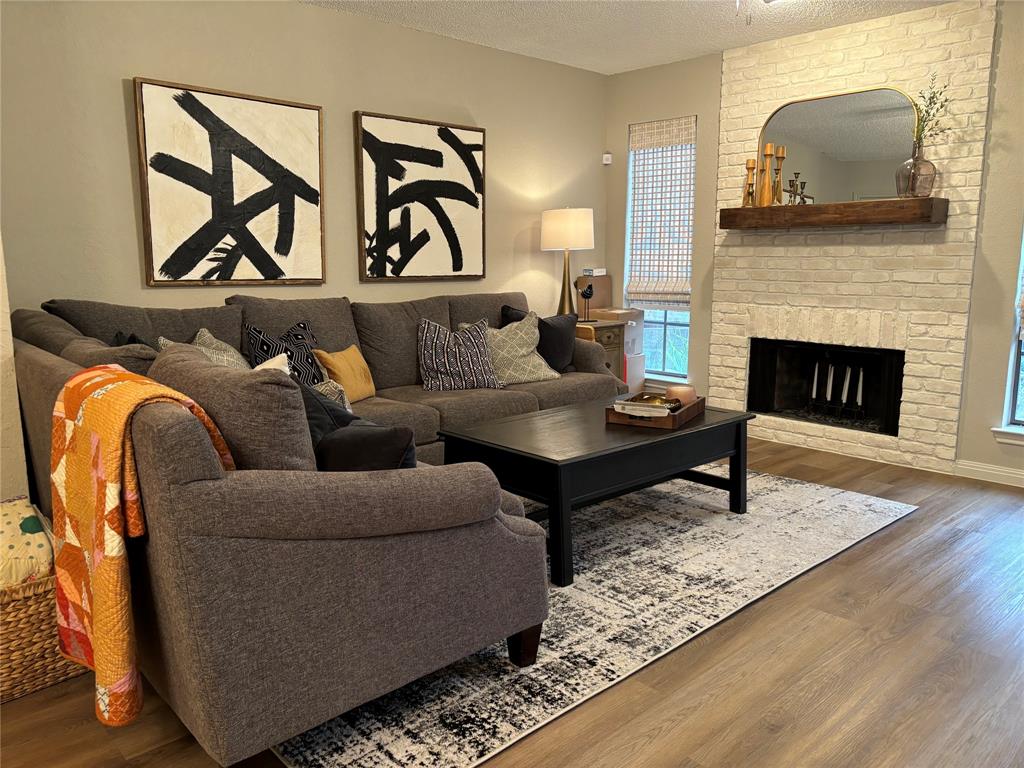 **Back on the market due to buyer's financing that was not approved.** Discover the perfect blend of comfort and convenience in this beautifully maintained 2- story townhome! This home offers 2 bedrooms, 1 full bath, and 1 half bath with updates to bathrooms and kitchen in November of 2024. The living area includes a wood-burning fireplace with access to the private backyard with a concrete patio, flowerbeds, and wooden fence. Covered carport parking is located at the rear of the home. Conveniently located near Hulen Square and the Chisholm Trail Parkway for easy commuting.