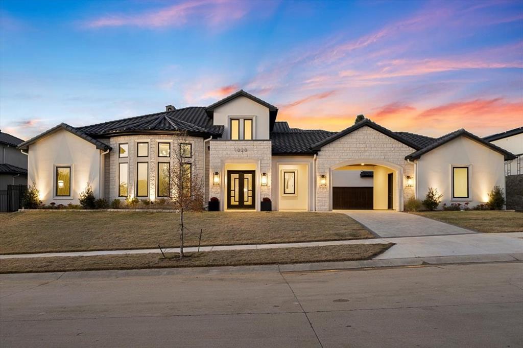 ENCHANTED HILL'S MASTERPIECE!! This magnificent modern contemporary masterpiece epitomizes pure luxury! Crafted by the renowned Lewis & Earley Custom Homes, this residence is located in the exclusive, guard-gated community of Enchanted Hill in North Dallas. Spanning over 7,000 square feet, this impeccably designed floor plan offers the ultimate comfort and sophistication. The home boasts 5 exquisite bedroom suites, 5.5 baths, and a stunning music room (or home office) with breathtaking golf course views. Entertainment spaces include a music room, an alcove, a game room, a media room, and a wine-tasting retreat. Fitness enthusiasts will love the dedicated workout room, while culinary aficionados will appreciate the prep kitchen, elegant dining room, and show-stopping Chef’s kitchen, complete with a large island, spacious breakfast nook, and top-of-the-line appliances. The owner’s suite is a sanctuary, featuring a spa-like bath and a generous walk-in closet. A private guest suite, media room, and wine-tasting room are conveniently located on the first floor. Upstairs, you’ll find a sprawling game room with a wet bar, three additional bedroom suites, a full-size laundry room, and front and rear balconies offering serene views. Step outside through expansive sliding doors to a remarkable outdoor veranda equipped with a built-in grill, refrigerator, and a $250k Las Vegas-inspired pool featuring a huge spa, fishing dock, and cascading waterfalls. The Porte Cochere, extended motor court, and five-car garage make a grand statement while ensuring convenience. Every detail of this home exudes sophistication and style. Castle Hills Golf & Country Club Community offers 26 parks, 6 pools, sports fields, fitness facilities, multiple fishing ponds, lakes, walking and biking trails. Additionally, it's just a 10-15 minute drive to world-class shopping, dining, and entertainment at multiple venues including Grandscape, Legacy West, The Star Cowboys, and PGA headquarters.