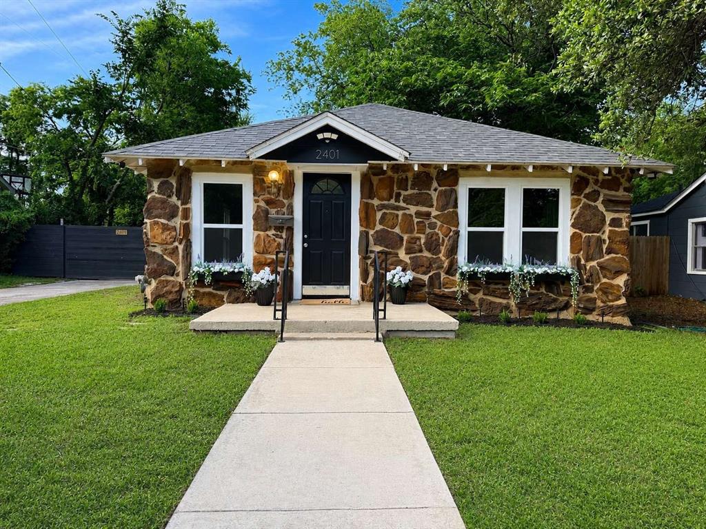 Welcome to 2401 Lillian Street, a beautifully updated 1924 home that blends timeless character with modern improvements. Situated on a spacious 7,318-square-foot lot in Fort Worth, this move-in-ready 2-bedroom, 1-bath residence offers comfortable living spaces and inviting outdoor areas.
Inside, you'll find luxury vinyl plank flooring throughout much of the home, while the primary bedroom features original hardwood flooring that adds warmth and character. The updated kitchen offers a functional layout, fresh finishes, open shelving, and durable countertops designed for everyday living. The renovated bathroom combines style and practicality. New energy-efficient windows installed in 2026 feature inward-opening sashes for easy cleaning and help fill the home with natural light throughout the day.

The flexible floor plan includes a secondary bedroom that can easily adapt to a variety of needs, along with a dedicated laundry and utility room that provides functionality rarely found in homes of this size. Major improvements include a new roof (2023), new energy-efficient windows (2026), and enhanced attic insulation for improved comfort and efficiency.

Outside, a detached garage, extended concrete driveway, and fenced backyard provide flexibility for parking, storage, hobbies, and outdoor living. Mature shade trees create a peaceful backyard setting, while the patio offers an inviting space for relaxing or entertaining.

Conveniently located near the Riverside Arts District, Downtown Fort Worth, the Medical District, dining, shopping, entertainment, and major commuter routes, this home offers easy access to some of Fort Worth's most desirable destinations while maintaining the charm and character of an established neighborhood.