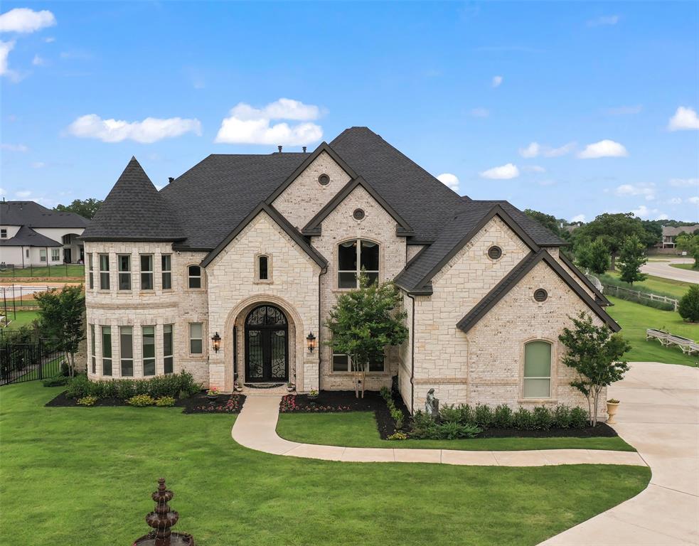 Welcome to this stunning 6891 sq ft home nestled on a one acre private cul-de-sac lot, offering breathtaking views of the surrounding natural areas with 6 bedrooms & 6 baths. As you enter the grand foyer, you are immediately greeted by timeless elegance & attention to detail. The heart of this home is the chef's kitchen, adorned with top-of-the-line appliances, custom cabinetry & large center island. The luxurious primary suite is a sanctuary boasting a spacious layout, and en-suite bath with free standing tub, dbl walk-in shower, dual vanities & custom designed closets. There's a private guest suite with bath on the main floor while upstairs you’ll find the 4 secondary bedrooms as well as generously sized game & media rooms with bar. The expansive backyard awaits your imagination while the covered patio is an idyllic spot for dining and lounging. Located in one of Flower Mound's most coveted neighborhoods with easy access to schools, shopping, dining & just min from DFW Intl Airport.
