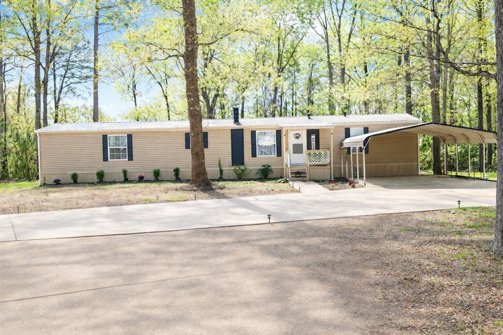 Move-in ready home on a quiet street in Benton! This updated 3 bedroom, 2 bathroom home sits on over half an acre and offers the space and privacy buyers are looking for. Recent improvements include fresh paint throughout, a brand new concrete driveway, and a newly built carport. Inside you’ll find a warm and inviting living area with a cozy wood-burning fireplace, perfect for relaxing evenings at home. The shaded lot provides plenty of room to spread out, entertain, or simply enjoy the peaceful surroundings. Located just a few blocks from Cypress Bayou, this home offers a great combination of quiet country-style living with convenient access to town. Homes with this much space in Benton don’t last long—schedule your showing today!