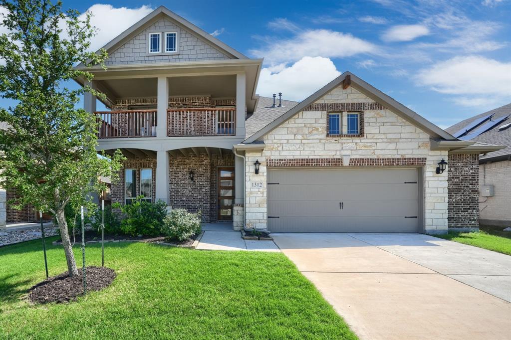 Stunning two story home in Aubrey offering 4 bedrooms, 3.5 bathrooms, and a 2.5 car garage. This beautifully designed property features rich wood flooring throughout the main living areas and a formal study off the foyer, perfect for working from home. The open concept layout showcases a gourmet kitchen with white cabinetry, quartz countertops, and built in stainless steel appliances, plus a bright breakfast nook with soaring two story windows. The spacious primary suite includes a relaxing garden tub, separate shower, and dual sinks. Upstairs features a second primary suite and a game room overlooking the living area below. Enjoy the extended covered patio, ideal for entertaining, along with a fully fenced and landscaped interior lot. $5,000 in Seller Concessions is being offered.