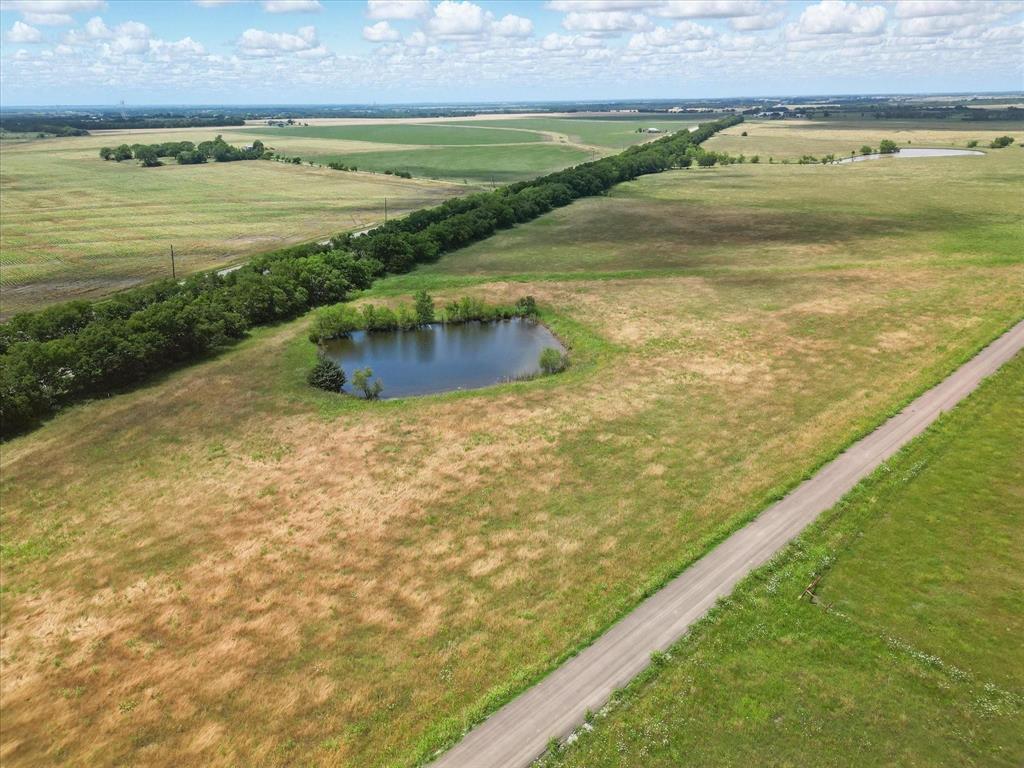 Just Under 2 Acres – Located in Hunt County Between Leonard & Celeste Looking for country living without being too
far from the city? Lot 5 offers 1.78 acres in a newly platted subdivision in Hunt County, ideally
located off Highway 69 and County Road 1040. Enjoy the peace and quiet of small-town life while staying conveniently
connected—only 15 minutes to Greenville, 40 minutes to McKinney, and just over an hour to DFW Airport. Electric poles
have just been installed along the front of the property, making it ready for your next step. Situated in Celeste ISD,
this property has minimal restrictions—bring your own builder, your own floor plan, or place a new double-wide
manufactured home. Animals are welcome, giving you the freedom to create your ideal country lifestyle. The land is
clean and open, located in a beautiful, well-kept area surrounded by large tracts that offer scenic countryside views. A
small pond on the property adds both charm and functionality. Enjoy breathtaking sunrises and sunsets that stretch for
miles, along with wide-open skies and peaceful, starry nights. With oiled road access and a tranquil rural setting, this
property offers the perfect mix of serenity and convenience. Whether you're ready to build your dream home, bring in
a new mobile home, or invest in land in a growing area, this property gives you the flexibility and space to create the
lifestyle you’ve been dreaming of. Don’t miss this opportunity to own your piece of the country at an affordable price!