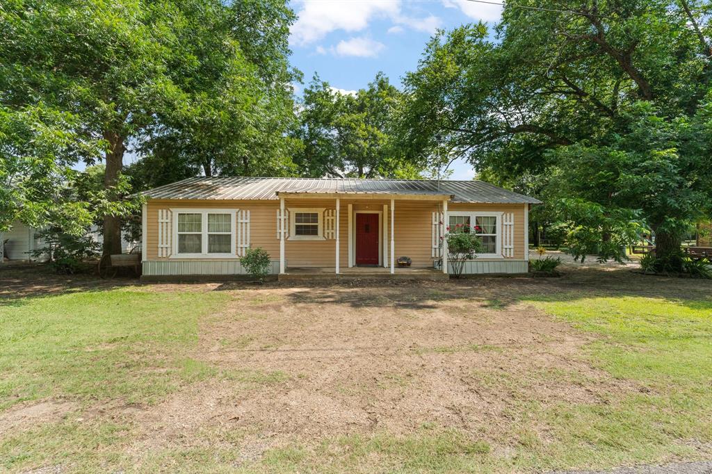Great opportunity in the heart of Grandview! 402 College St offers small-town charm, a spacious layout, and the chance to add instant value with one final bedroom and bathroom ready to be finished out. The main living areas of the home are already complete and move-in ready, giving you a comfortable place to settle in while you customize the remaining space to your needs. The home sits on a generous lot with multiple outbuildings, including a 12x24 workshop and carport, plus a 20x14 storage building providing plenty of room for projects, hobbies, and extra storage. Inside, the existing finished spaces are bright, functional, and welcoming—ideal for everyday living or for someone looking to invest in a property with upside. Spacious kitchen has gas stove, dishwasher and island. Large dining area and living area. With an acceptable offer, the seller is willing to leave building supplies for the unfinished bedroom, plus a freezer, dryer, queen-size bedframe, and bedroom furniture, making this an even more attractive package. Located close to schools, parks, and Grandview’s local conveniences, this property offers flexibility, potential, and a great location. Whether you're a first-time buyer, investor, or someone looking for a home you can personalize, this home is a standout opportunity.