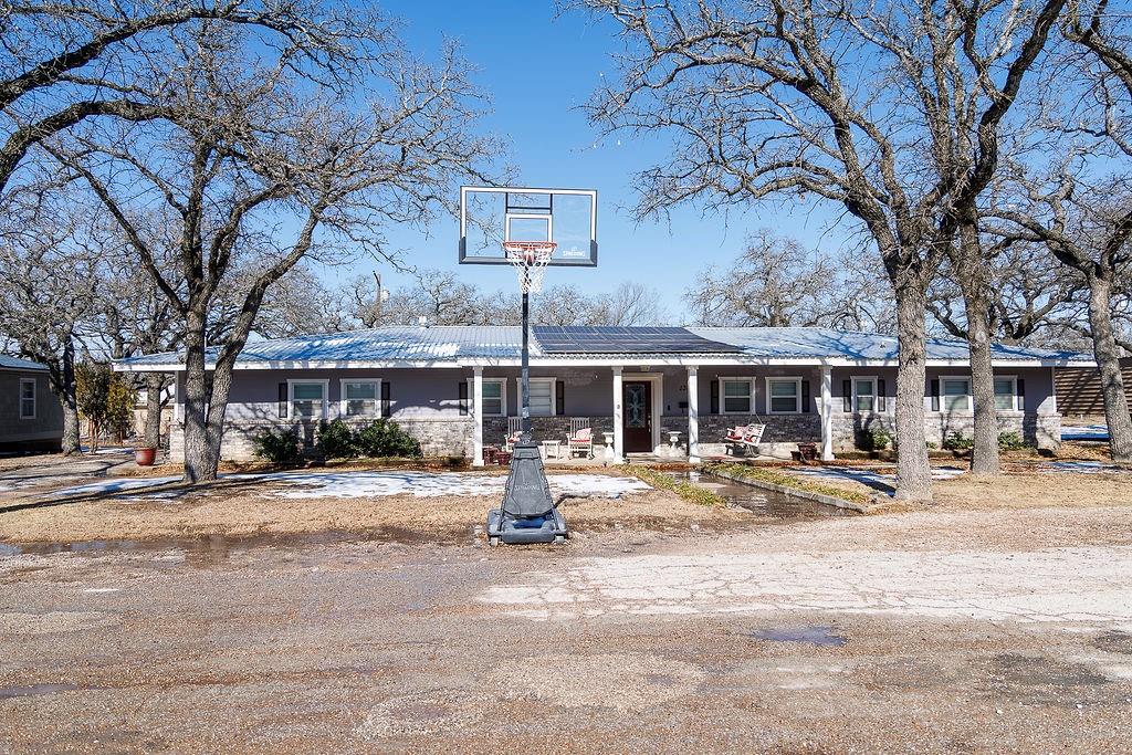 This beautiful 4-bedroom, 3-bath brick home sits on nearly half an acre and offers space, comfort, and thoughtful upgrades throughout. Conveniently located near Cisco Junior High and High School, making it an excellent choice for families. Featuring paid-off solar panels, this property delivers energy efficiency and long-term savings.
Inside, you’ll find a stunning kitchen with granite countertops, an eat-in dining area, and an abundance of cabinet space, perfect for everyday living and entertaining. The home boasts large bedrooms, two spacious living areas, and several major updates, including brand-new gas lines, a new water heater, and a new central heat and air unit on the east side of the home.
Step outside and enjoy the charm of a covered front porch with a swing, plus a huge covered back porch with patio area overlooking the fenced backyard, ideal for relaxing, gatherings, or pets. The property also includes a well for watering the yard, keeping landscaping lush and costs low.
Storage and workspace are abundant with a storage building with a 2-car carport attached and a workshop with electricity and an additional 2-car carport. Mature oak trees in both the front and back yard provide shade, beauty, and a peaceful setting.
This home truly offers the perfect blend of functionality, charm, and outdoor space.