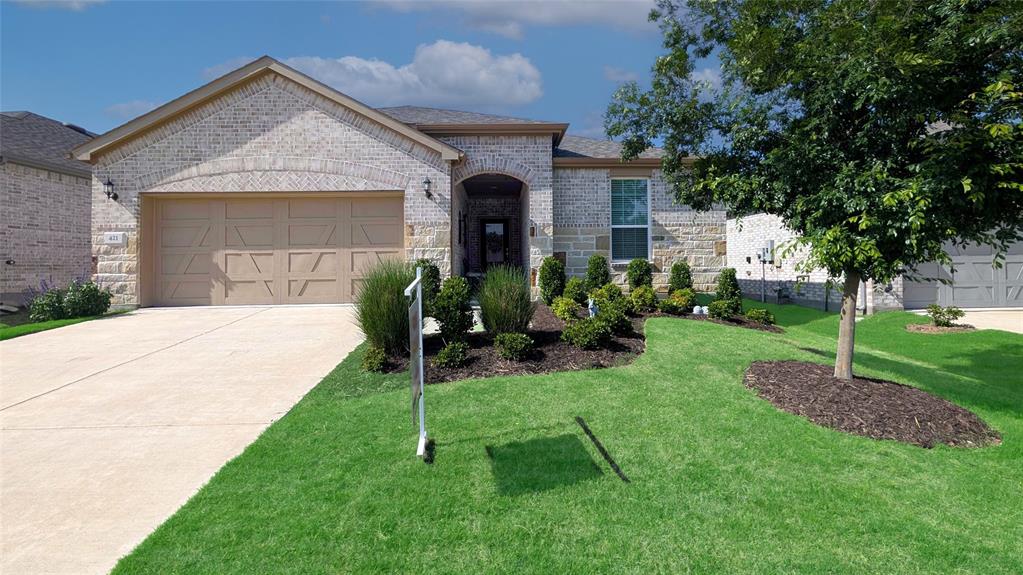 Trinity Falls 55+ by Del Webb .This is a Summerwood floor plan with the enclosed sunroom which makes the home approximately 2,270 sq ft. It features 3 bedrooms, Office, and 2 full baths. Owners put over $22k in upgrades including appliances, lighting, cabinets and countertops. The flooring has been upgraded throughout with 7in Luxury Vinyl Plank Pine. You drive up to an inviting brick & stone combination and front door with rain glass. Kitchen features stainless steel appliances, gas cooktop, quartz countertops. The floor plan is open with family room connected to sunroom that leads to the large 26ft long covered patio.The primary ensuite has dual sinks and large walk-in shower with handrails. Del Webb at Trinity Falls includes full time lifestyle director on-site, 10,000 sq ft clubhouse, events, pickleball and Bocce ball, swimming pool and spa, walking trails and fitness center all included. This is a great opportunity!