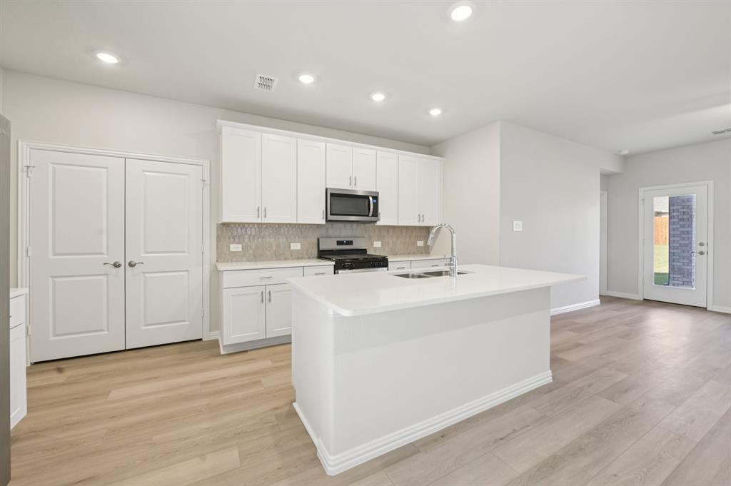 BRAND NEW energy - efficient home Jul 2026! Turn the kids loose in the second-story loft space while hosting downstairs in the open concept living area. White cabinets with veined white quartz countertops, muted beige EVP flooring with light taupe carpet. Lakehaven is a master-planned community located at the edge of Lavon Lake, featuring all of the modern amenities. Family time will turn into lake time during the warm Texas summers. The Spring Series will boast six floorplans from our National Park Collection that range in size from approximately 1,270 sq. ft. to 2,255 sq. ft. Each of our homes is built with innovative, energy-efficient features designed to help you enjoy more savings, better health, real comfort and peace of mind.