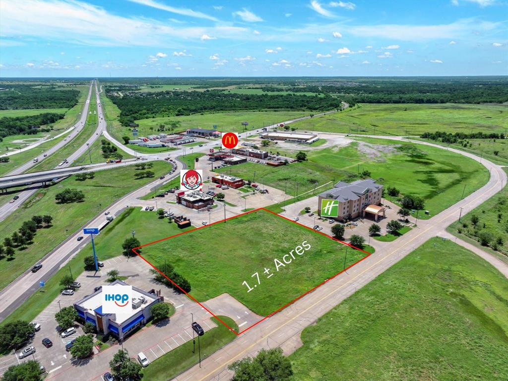 Prime 1.78± Acre Commercial Site in The Shops at Terrell – Terrell, TX. Outstanding opportunity to acquire a multiple building commercial tract located within a high-traffic area in The Shops at Terrell in Terrell, TX. Strategically positioned, this site offers excellent visibility and accessibility just off Interstate 20. Neighboring national brands include McDonald's, Wendy's, Nike, Old Navy, Reebok, and Levi's—contributing to strong area traffic and consumer draw. Located in Kaufman County, the second-fastest growing county in the United States, this property benefits from robust regional growth and new residential developments nearby. With The Shops at Terrell currently 87% occupied by premier retailers, this location presents exceptional potential for retail, hospitality, or restaurant development. Just 30 miles east of Dallas, this site offers both local appeal and regional reach, making it ideal for investors or end-users looking to capitalize on continued growth along the I-20 corridor. Water and sewer available on-site.