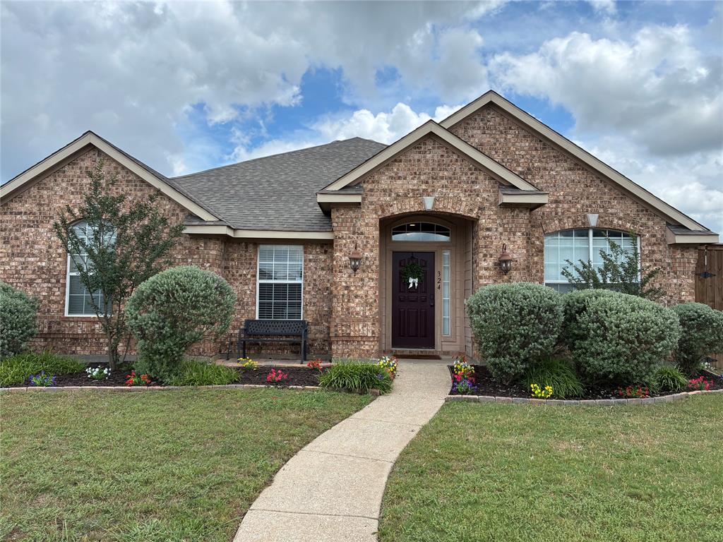 WELCOME TO YOUR NEW HOME!!! ANYONE THAT ENTERS ALWAYS SAYS, “WOW!!! WHAT A BEAUTIFUL HOME! Located in a welcoming community, this home offers easy access to local parks, schools, shopping, dining, and major commuter routes, making daily errands and downtown Dallas trips convenient. 
This thoughtfully designed home blends generous living spaces with warmth, comfort, style, and functionality. You’re greeted by an expansive foyer with high ceilings that opens to sun-filled living areas and a thoughtful split floorplan.
Main living room offers a spacious gathering space creating the perfect setting for movie nights, social events, or quiet evenings at home. 

The extra large, expansive kitchen serves as the true heart of the home, designed to offer ample countertop space, kitchen island, with luxurious granite, stainless steel appliances and backsplash galore! Light and bright abundant cabinetry, with elevated finishes, and a layout that makes meal preparation and conversation seamless. Its connection to both the living and dining areas ensures you’re never far from guests or family. 
The home’s private quarters are comfortable and well-proportioned. The primary bedroom offers a peaceful retreat with generous space for any furniture set, along with an upgraded en-suite bath that provides convenience and privacy. 
FIVE additional bedrooms are bright, modern, and versatile while providing flexibility for guests, a home office, home gym, hobby room or growing needs. You will love the modern frosted glass barn doors as you enter! Fabulous hardwood look tile floors throughout…ZERO CARPET for your allergy needs and fur babies! 2 car garage on back alley. Natural log fireplace for those cold nights!  
CORNER LOT!!!!! 8 FOOT TALL PRIVACY FENCE added! Room for RV gate. The spacious backyard offers room to personalize, whether you envision outdoor gatherings, play space, or future enhancements. THE LIST GOES ON!!! HURRY and make this Teakwood beauty your new home!!!