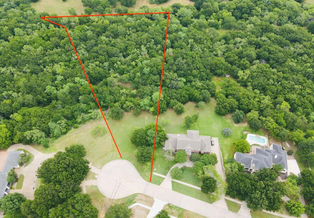 Discover the perfect setting to build your custom dream home in the highly sought-after Lake Ridge community. Nestled on more than 2 acres, this stunning homesite offers mature trees, peaceful surroundings, and scenic views. Enjoy nearby outdoor adventures including biking, hiking, boating, and fishing, all just minutes from Joe Pool Lake, Cedar Hill State Park, and Tangle Ridge Golf Club. Conveniently located near shopping, dining, and easy access to both Dallas and Fort Worth, this property combines natural beauty with city convenience.