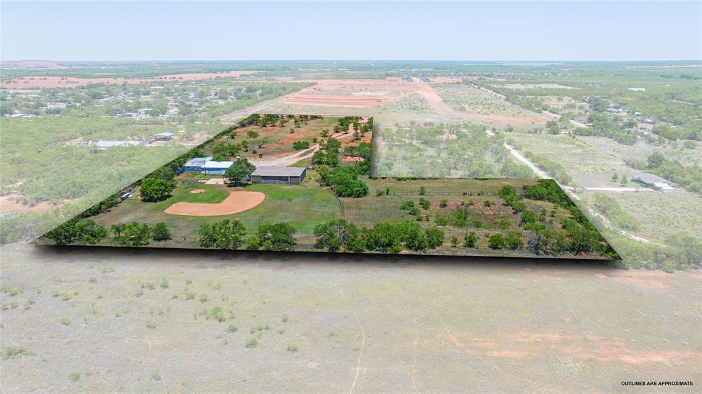 You have seen the descriptions that say TRUELY UNIQUE property and you have seen how some of them are just a little different... Well, this one NEEDS to be seen in person! Roughly 12 acres with 2 large buildings, a small restroom building with two restrooms and OH YEAH, your very own baseball diamond. It is actually a full field perfect for a little league team. The building to the east is a large rectangular building that currently has baseball batting net cages set up. There is a little bit of waiting and viewing area as well as a storage area and elevated viewing and office type area. The building to the west also has some space that has been used for batting cages. It has an improved office space on the NW corner and is currently set up as shop space, warehouse storage and a strength and conditioning workout space. All of that and we havent even really started to talk about the rest of the acreage. There is a squeeze chute and the left overs of a roping arena. The owner had someone dig out a stock tank but the dirt doesn't hold water as it is. Could be a head start for someone needing it.