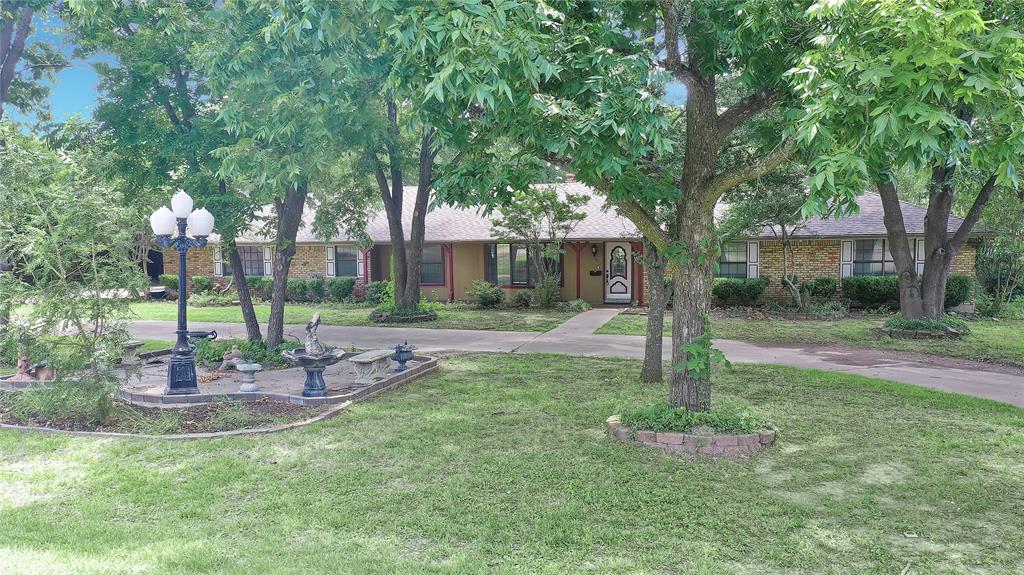 4 Beds,3 Full Baths,Over 3100 SF, on a Rare 1.433 acre InTown Lot!Excellent curb appeal with a circle drive under a canopy of mature shade trees. The house is ready for a serious style update,but there is SO MUCH to Work with here!Living room with Vaulted Ceiling & Stone WBFP,Home Office with built-in storage,Dining room with built-in china hutch,Plus a HUGE Game Room with wood burning stove!The primary suite features built-ins and a gas fireplace,dual walk in closets and oversized walk in shower.The kitchen features plenty of storage,granite counters and a sunny sky light!Enjoy outdoor time on the 25x40 covered patio featuring a 6x8 walk in safe room.The property also has an in ground storm shelter and 16x24 storage building. But we're not done yet!Be sure to check out the 2100 sf metal shop with 4 bay overhead doors, concrete flooring,electric,H2o,heat & ac, built in cabinets and a full bathroom.This One Of A Kind Property is waiting for you to make it YOURS!