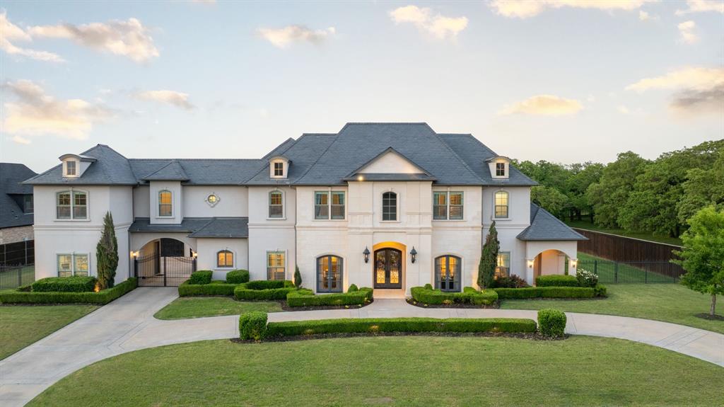 Welcome to a truly extraordinary custom estate nestled on an acre in the prestigious Reserve of Southlake. This architectural masterpiece offers an unparalleled lifestyle of luxury, privacy, and sophistication. From the moment you arrive, the home's presence is undeniable — a sweeping circle driveway invites you in, framed by pristine landscaping, mature trees, and timeless curb appeal that creates an unforgettable first impression. The grand entrance sets the tone with soaring ceilings, a statement staircase, and exquisite designer finishes that hint at the quality craftsmanship found throughout every inch of this estate. Inside, the thoughtful floorplan seamlessly blends everyday comfort with dramatic architectural details. Discover hidden rooms, adding a layer of intrigue and exclusivity that elevates the home beyond the ordinary. Expansive living areas are filled with natural light, featuring elegant textures, custom millwork, and luxury finishes at every turn. The gourmet kitchen is a chef’s dream, with top-of-the-line appliances, oversized island, and intimate dining spaces that make entertaining a breeze. Step outside to your personal resort-style paradise — a hotel-inspired pool surrounded by lush tropical landscaping, private cabanas, and multiple lounge areas, creating the perfect backdrop for relaxation or large-scale entertaining. The expansive backyard also includes a private sports court, ideal for basketball, tennis, or pickleball, offering endless opportunities for outdoor fun. Every corner of this home is designed with purpose and elegance, offering not just comfort, but a lifestyle reserved for the most discerning buyer. Whether hosting lavish gatherings, spending quiet evenings under the stars, or exploring the hidden features tucked throughout the home, every day feels like resort living at its best.