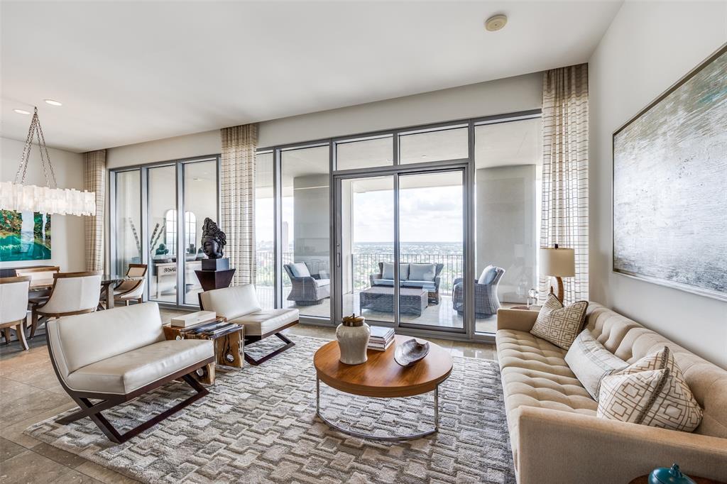 Experience the best in luxury high rise living in the Lionel Morrison designed One Arts Plaza building! Located in the heart of the Arts District, this one bedroom, one and a half bath residence is within walking distance to the Dallas Museum of Art, Meyerson Symphony Center, Moody Performance Hall, and Winspear Opera House. Elegance abounds in this sleek and modern unit with eleven foot ceilings, floor to ceiling windows, and a 50 X 10 foot covered terrace overlooking East Dallas. Natural light flows through the living room and dining area creating an ideal entertaining space, or also a quiet space to just relax. Open Balthaup kitchen offers island, eat in kitchen, Miele appliances, subzero wine cooler plus an integrated refrigerator and freezer.
The primary bedroom includes a sliding glass door to the terrace, a spa worthy bathroom with separate tub and shower, and custom closet space. A versatile office space is located off the primary bedroom. In addition to this fabulous downtown Dallas location within close proximity to fine dining and shopping, One Arts amenities include a pool, fitness center, doorman, valet, 24 hour security and concierge, event room, electric car chargers, and two assigned parking spaces.