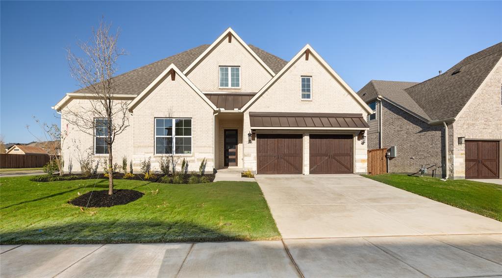 Gorgeous 1 story UnionMain home with 4 beds, 3 and a half baths, media room, flex area, 3 car tandem garage and covered back patio! Tray ceiling details greet you in the foyer and carry through the open living room with a sleek linear gas fireplace, flowing seamlessly into the dining area and chef's kitchen. The kitchen has custom-finished cabinetry with 42 inch upper cabinets with crown molding, granite countertops, stainless steel undermount sink with a Delta Essa pull-out faucet and a full GE stainless steel appliance package including a 36 inch built-in gas cooktop, single wall oven and built-in microwave. Resilient plank luxury vinyl flooring runs throughout the main living areas, with plush carpet in the bedrooms and tile in all bathrooms. The primary suite is a private retreat with tray ceiling detail, large closet and a spa-inspired bath featuring separate shower, soaking tub and 2 sinks. Three additional bedrooms share well-appointed baths and one bedroom has dedicated bathroom. The utility room includes built-in overhead cabinets and a separate mud room with 9 cubby holes, bench and 4 hooks. This home is as smart as it is beautiful — equipped with a video doorbell, Alexa Show, WiFi prewire, Cat5e data outlet, local HDMI and a Honeywell programmable WiFi thermostat. Energy efficiency is built in with high-efficiency 16 SEER HVAC system, HERS certification, tankless hot water heater, dual-pane Low-E argon gas windows, radiant barrier roof decking, 4 inch MERV 10 media filters, water-conserving Delta faucets, LED lighting throughout, rounded corner walls, 8 foot six-panel interior doors. HOA features swimming pool, fitness center, amenity center and biking trails. Photos are representational and are not of the real property. Available for move in OCTOBER 2026.