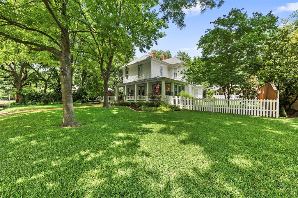 Welcome to 604 W. Jefferson St, Waxahachie TX! Nestled in the heart of the historic West End District, this absolutely stunning farmhouse blends timeless character with luxurious modern updates. This completely renovated with impeccable attention to period design, this home showcases gleaming hardwood floors, abundant natural light, original-style moldings, and designer lighting throughout. The showstopping kitchen has been meticulously crafted for both beauty and function, featuring a 48” Wolf range, custom Sub-Zero refrigerator, marble countertops, and custom cabinetry. The spacious downstairs primary suite offers a peaceful retreat with a beautifully designed period-style bath, standalone soaking tub, and full-size stacked laundry. Additional living spaces include an oversized sunroom and a welcoming living room overlooking the quiet tree-lined street. Upstairs, two charming bedrooms share a stunning vintage-inspired bathroom. Step outside into a truly magical outdoor sanctuary. Flowering magnolias, Japanese maples, and lush gardens surround the property, creating a private secret garden atmosphere. Enjoy morning coffee on the expansive front porch or unwind on the serene back porch. Modern conveniences include a tankless water heater, crushed granite driveway, oversized covered carport, outdoor lighting, sprinkler system, and so much more. This one-of-a-kind gem offers the perfect blend of classic farmhouse charm and sophisticated modern living. Come fall in love with this amazing home within walking distance to downtown Waxahachie, restaurants and night life. Many furniture pieces are available for sale. Inquire with listing agent. NEW ROOF INSTALLED JUNE 13, 2026 ON BOTH HOUSE AND CARPORT.  
NO SHOWINGS FROM FRIDAY JULY 10 THRU JULY 12 AS SELLER WILL BE DOING AN ESTATE SALE THIS WEEKEND.