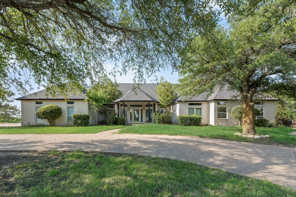 Are you ready to see your fixer upper? Tired of the big city life or is that once small town getting overcrowded? Look no further… sitting on over an acre in charming Italy, Texas, this 4-bedroom, 3-bath home is full of opportunity, character, and the kind of potential fixer-upper fans dream about.

With great bones and plenty of space to work with, this home features a split-bedroom layout, an oversized game room, and a spacious primary suite complete with a see-through fireplace, jetted tub, separate shower, and large walk-in closet just waiting for your modern farmhouse touch.
Step outside and imagine the possibilities — an enclosed pool ready for summer gatherings, a sand volleyball court for weekends with friends, mature trees, and wide-open space perfect for creating your own backyard oasis.

Whether you're envisioning shiplap and rustic charm, cozy gathering spaces, or a complete custom makeover, this property is the perfect canvas to bring your vision to life while building instant sweat equity. Tucked away on a quiet country street but conveniently located just minutes from highway access, this hidden gem offers the peaceful lifestyle you've been searching for with all the potential to become something truly special.
