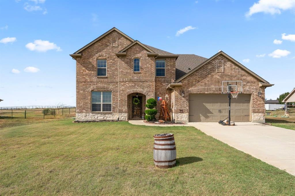 Beautiful 4 bed, 2.5 bath home on a full acre built by Christopher Grace Homes, offering space, privacy, and an open concept layout filled with natural light. The main living area features tall ceilings, large windows, and a bright flow into the eat in kitchen with a spacious island—perfect for everyday living and gathering.
A dedicated office or flex space on the main level adds versatility for work, guests, or play. The first floor primary suite offers a relaxing retreat with a soaking tub, separate shower, and dual sinks, while three additional bedrooms and a loft upstairs create a comfortable second living area.
Outside, the 1 acre lot gives you room to spread out—ideal for play, pets, gardens, or evenings around the fire pit.
Located just outside Ponder city limits with NO CITY TAXES, you still enjoy quick access to everyday essentials. 10 minutes to the new H E B, 15 minutes to Razor Ranch in Denton, and 13 minutes to Northlake Town Center now home to Tom Thumb. Groceries, dining, and shopping are all within an easy drive.
A rare blend of acreage, natural light, and convenience.