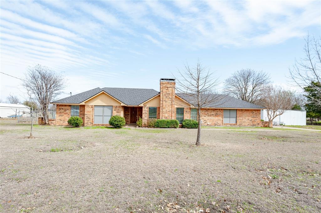 Enjoy the perfect blend of country living and everyday convenience at 112 Deborde Circle! Situated on approximately 1.47 acres outside the city limits, this beautifully updated 3-bedroom, 2-bath home offers plenty of space both inside and out while remaining just minutes from Ovilla Road, I-35E, I-45, and Loop 9.

Step inside to an inviting open-concept floor plan featuring luxury vinyl plank flooring throughout, a stunning stone wood-burning fireplace, and a convenient dry bar, making the living area ideal for entertaining family and friends. The versatile flex space can easily serve as a fourth bedroom, game room, home office, media room, or whatever best fits your lifestyle.

The spacious primary suite is a true retreat, complete with two closets, an ensuite bath featuring dual sinks, a jetted soaking tub, and a separate shower. An oversized laundry room provides additional functionality with room for a second refrigerator or freezer, craft space, or extra storage.

Outside, you'll find a peaceful patio overlooking the expansive backyard, perfect for relaxing mornings and quiet evenings. A standout feature of the property is the impressive approximately 1320 sq ft shop with three overhead doors and electricity, offering endless possibilities for a workshop, hobby space, extra vehicle parking, RV storage, boat storage, or recreational equipment.

If you're looking for room to spread out, modern updates, and a prime location with easy access to major highways, this property checks all the boxes. Don't miss your opportunity to own this exceptional Red Oak property!