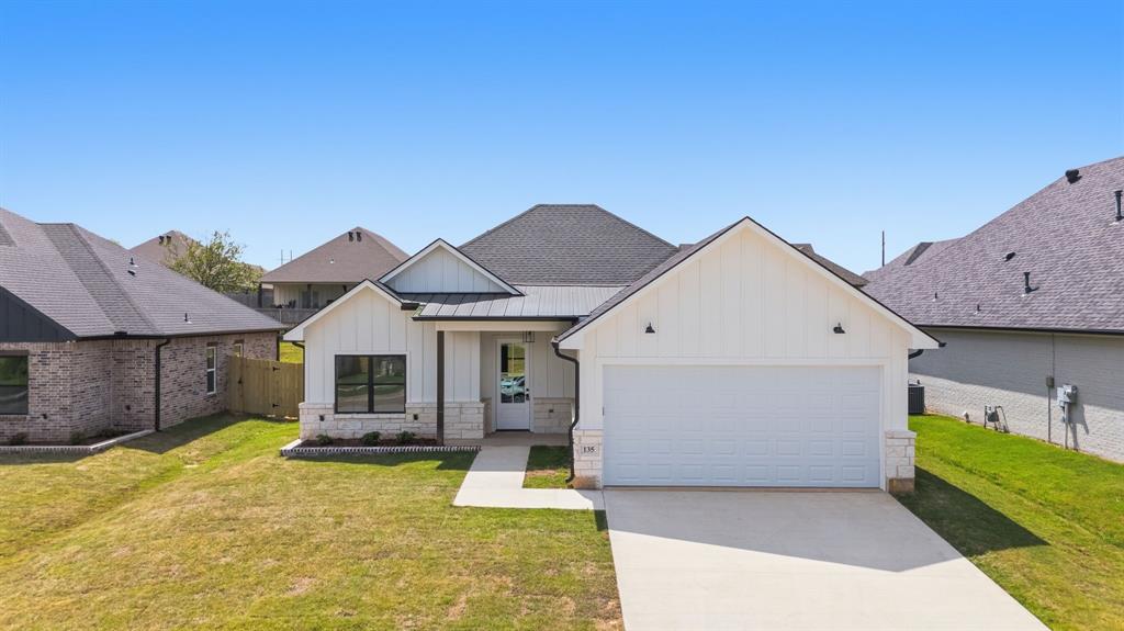 Stunning new construction located at 135 Kaul Lane in one of Bullard’s most sought-after neighborhoods! This beautiful 4 bedroom, 2 bathroom home with 2 car garage offers approximately 1,900 square feet of thoughtfully designed living space.
From the moment you arrive, you’ll notice the eye-catching curb appeal featuring a stylish combination of Austin Stone, neutral brick, and siding. Step inside to a welcoming entry and enjoy 10-foot ceilings throughout, creating an open and airy feel.
Off the entry is the 4th bedroom which would make an ideal office with views of the front yard.  The spacious living area features a centered brick fireplace and flows seamlessly into the open-concept kitchen.  The large brick fireplace has built in cabinets on either side.  The kitchen has custom cabinetry to the ceiling, a large center island, and a walk-in pantry which makes it perfect for both everyday living and entertaining.
The secondary bedrooms are generously sized with ample closet space. The private primary suite is located at the back of the home and includes a luxurious ensuite bath with double sinks, a walk-in shower, and a large walk-in closet with built-ins.
Step outside to a nicely sized backyard that is fully fenced, completely sodded, and equipped with a sprinkler system. Enjoy relaxing or entertaining on the large covered back patio. This home truly combines style, comfort, and functionality - make your appointment today!