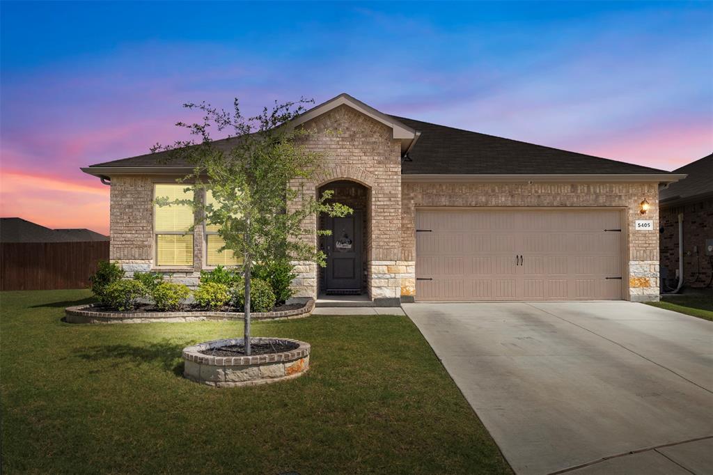 Welcome to 5405 N Wind Lane, a clean and well-maintained five-bedroom home sitting at the end of a quiet cul-de-sac in the Bailey Park neighborhood. The front of the house has great curb appeal with updated decorative stonework around the tree and flower beds, and the cul-de-sac location means you do not have to worry about through-traffic. The property sits on a .33 acre lot which is a rare find in this community! 

Inside, the house has a great open layout with high vaulted ceilings that make the main living areas feel large and airy. The living room opens right into the kitchen and dining area, which is great for keeping everyone connected. In the kitchen, you will find a large center island, gas cooking, plenty of cabinet storage, a pantry, and lots of counter space for meal prep. The primary bedroom is tucked away on its own for extra privacy and includes an attached bathroom with double sinks and a large walk-in closet. The other four bedrooms are split from the primary suite, giving you plenty of options for a home office, guest space, or secondary bedrooms.

The backyard is one of the best parts of this property. It is an oversized lot with a massive grass lawn, a covered back patio, and tons of room for a garden, a pool, or outdoor entertaining. The current owners have loved the large yard, the friendly neighbors, and how close the house is to all three local schools.

Bailey Park residents get access to a great community pool, a playground, and nearby walking trails. The neighborhood is also just a quick drive from local grocery stores, restaurants, and daily conveniences, making this a highly practical place to live.