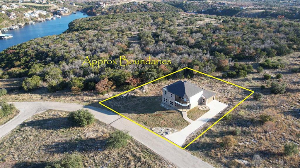 Fantastic opportunity to own a spectacular lake home in the gated Possum Kingdom Lake community of Gaines Bend! Built in 2021 and still has that new home feel! See the stunning blue waters of pristine Possum Kingdom Lake as you enter your spacious home in paradise! With a very open floor plan this home feels much larger than it actually is. Lots of covered decks to enjoy the beautiful views and fresh air will never get old. Sitting on almost a half acre, let your imagination run wild with the personal touches that suit you, plus the added bonus of no lots behind you, so feel free to feed the deer and enjoy the privacy you crave. Gaines Bend amenities include secure gate at the entrance, 2 boat ramps, and a day dock for convenience. Short term rentals are available, so why not let your lake house become an investment property, too!