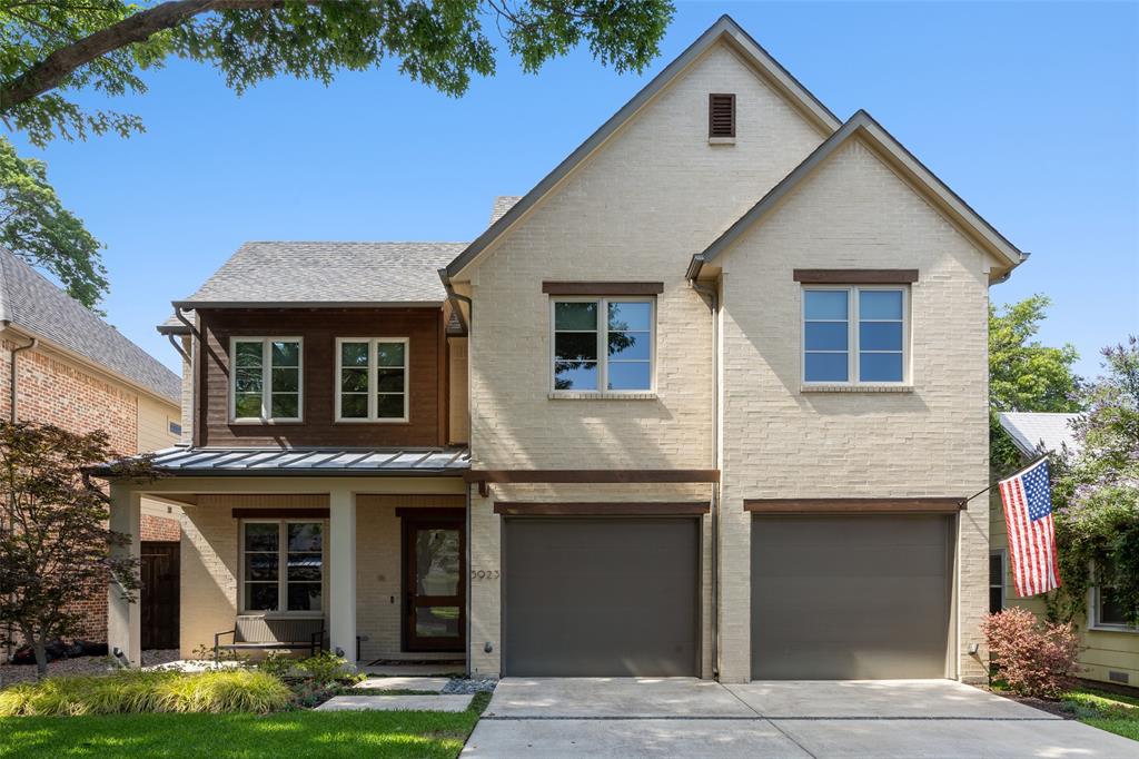 Tucked beneath mature trees in the heart of the coveted Mockingbird Elementary neighborhood, this exceptional residence blends timeless architecture with elevated modern living in one of East Dallas’ most desirable locations. Built by Newport and thoughtfully designed with refined finishes and functional living spaces throughout, the home offers sophisticated interiors and seamless indoor-outdoor entertaining. A welcoming front porch and beautifully landscaped approach set the tone for the home’s warm yet polished aesthetic. Inside, the formal entry opens to a handsome study with custom built-ins, while rich hardwood flooring, designer lighting, soaring ceilings, and abundant natural light flow throughout the open-concept floorplan. The chef’s kitchen features rift-cut oak cabinetry, marble countertops, a waterfall island, subway tile backsplash, built-in refrigerator, dual ovens, gas cooktop, vent hood, and extensive prep and storage space. The kitchen opens effortlessly to the spacious living and dining areas, ideal for everyday living and entertaining alike. Designed for comfort and flexibility, the home offers four generously sized bedrooms, each with ensuite baths, including a downstairs guest suite ideal for visitors or multigenerational living. Upstairs, the luxurious primary retreat features a spa-inspired bath with floating vanities, soaking tub, oversized frameless shower, and a large walk-in closet. A spacious game room or secondary living area adds additional flexibility. The backyard was designed for entertaining, complete with a covered outdoor living area, built-in grill and cooking station, fireplace, synthetic turf lawn, and wood privacy fencing. Additional highlights include a mudroom, full-size utility room, abundant storage, and attached garage. Ideally positioned just moments from Lower Greenville, this exceptional home offers luxury living in an unbeatable East Dallas location.