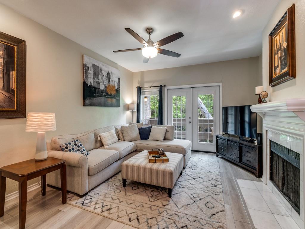 Priced to sell! Location, value, and convenience come together in this move-in ready townhome-style condo located on the second floor in the heart of the Lake Highlands area. This 2 bedroom, 2.5 bath home places you just minutes from premier shopping, dining, and entertainment.  Step into a bright, open living space featuring luxury vinyl plank flooring and abundant natural light. Double doors lead to a private balcony with peaceful treetop views—perfect for relaxing. The kitchen showcases quartz countertops, plenty of cabinets, and a decorative tile backsplash. The spacious primary suite offers beautiful tree-lined views and double closets, while the secondary bedroom includes its own private exterior entrance—ideal for added flexibility.  Enjoy being just steps from the community pool and minutes from I-635, NorthPark Center, and Lake Highlands Town Center. Both HVAC units were recently replaced. HOA includes water, sewer, and trash. Experience East Dallas convenience with a welcoming neighborhood feel in a highly desirable location.