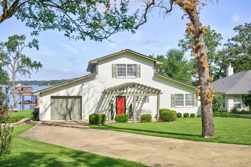 If you’re searching for a lake home with space for everyone, this one checks all the boxes. It features 3 bedrooms, 3 bathrooms, plus two additional overflow sleeping areas and a large upstairs space that could easily serve as a fourth bedroom. The generous dining area and thoughtfully designed kitchen make it perfect for hosting family and friends. The boathouse, just about a year old, provides deep-water access and is built with low-maintenance synthetic wood. It also includes a party deck and a lift for your personal watercraft. Outside, you’ll find a beautifully maintained yard with expansive open-water views, upper and lower wood decks, a screened-in porch, and an open-air outdoor shower—perfect for rinsing off after a day on the lake. This open-water retreat is well-suited for year-round enjoyment and offers an incredible opportunity to own waterfront property at an exceptional value.