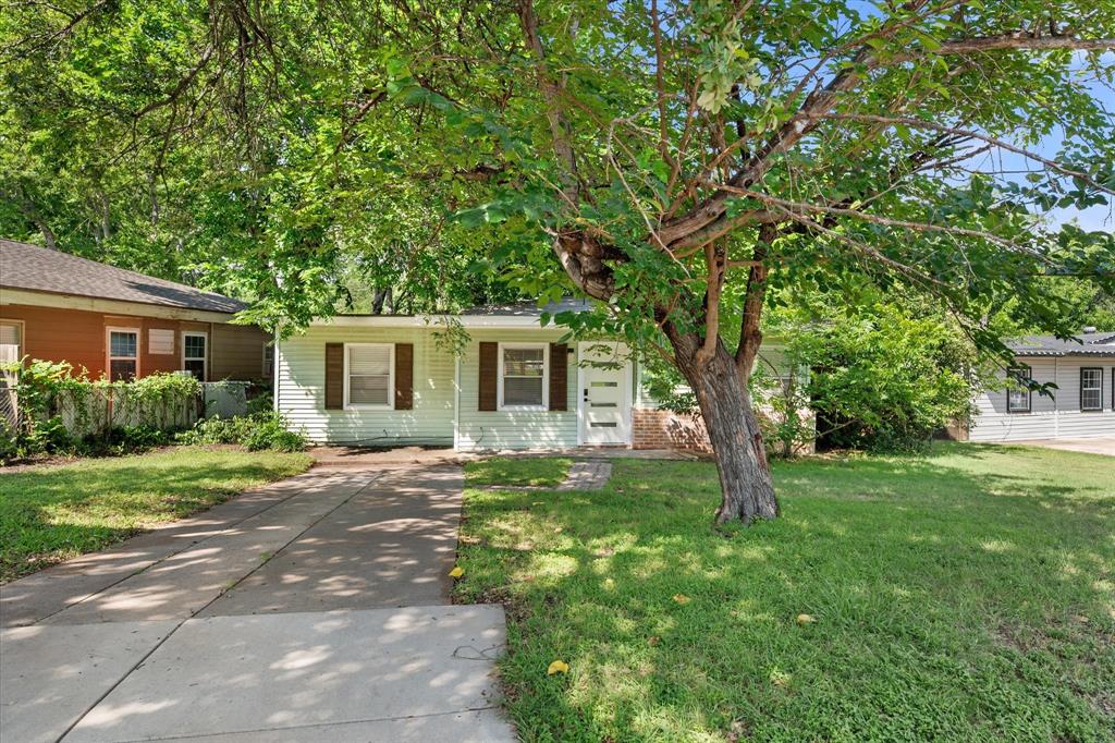 Charm and modern updates blend beautifully in this 1950s home. Notable features include new soffits, original hardwood floors, fresh interior paint, 2019 HVAC system, newer hot water heater, and stainless steel refrigerator, dishwasher, microwave, and everyone’s favorite, a gas range. Pre-listing roof inspection shows plenty of remaining life with no recommended repairs. The kitchen has been thoughtfully updated with shaker-style cabinets and quartz countertops, while the bathroom showcases designer tile and frameless shower door. The bonus room provides flexibility as a second living area, another bedroom or even a home office or gym. The spacious backyard offers a large covered patio, perfect for entertaining. Ideally located near Fort Worth attractions; minutes from downtown, Dickies Arena, Arts District, Medical District, Arlington Heights baseball fields, and more. Previously used as a rental with strong occupancy, offering an excellent investment opportunity or a wonderful personal residence. This home is move in ready and offers peace of mind with the updates, newer appliances and mechanics.
