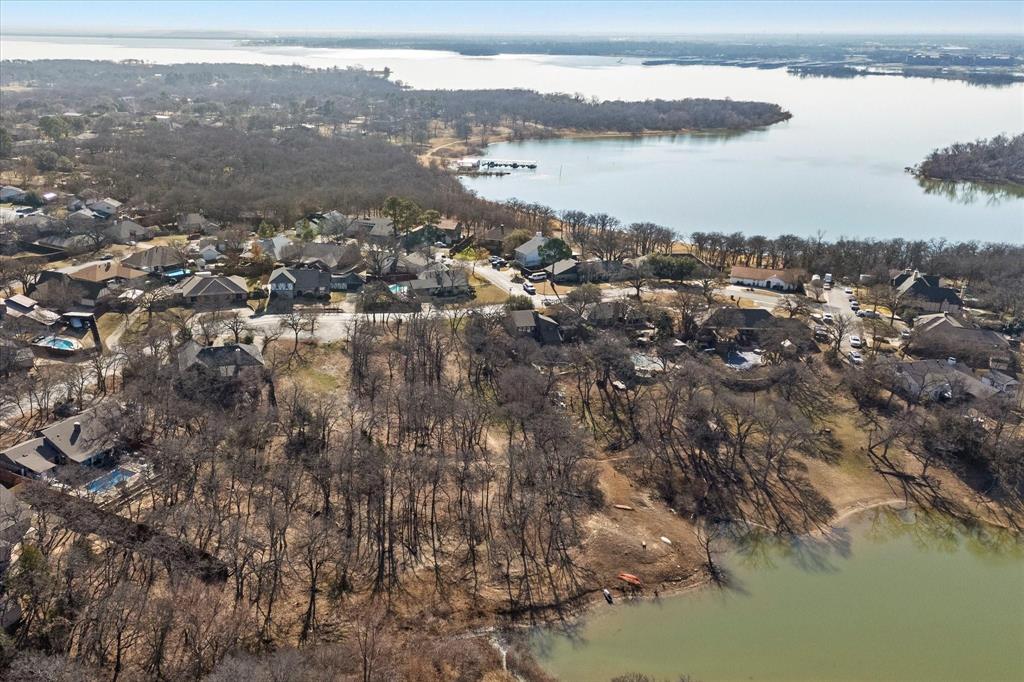 Discover a rare opportunity to own a stunning lakefront lot in the highly sought-after Royal Oaks subdivision near Lake Lewisville. Backing directly to Army Corps of Engineers land, this property offers exceptional privacy, protected views, and direct access to the natural beauty of the shoreline.
Imagine building your custom dream home just steps from the water, surrounded by mature trees, peaceful scenery, and breathtaking lake views. With portions of the lot already cleared, you have a head start on construction while still enjoying the character and privacy of a wooded homesite.
This property is build-ready with utilities, paved streets, and curbs already in place, making the process of bringing your vision to life seamless. With no HOA, you have the flexibility to design and build without restrictive guidelines.
A survey and topographical map are available, providing valuable insight as you plan your build. Whether you're looking for a serene retreat or a full-time residence, this lot offers the perfect blend of location, privacy, and opportunity.
Don’t miss your chance to own prime lakefront property near Lake Lewisville—opportunities like this are truly limited.