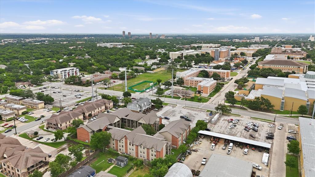 WOW! AMAZING REMODELED CONDO NEXT TO UNT CAMPUS!  Across the street from Pohl Rec Center. Steps away from West Hall Dining on those days you don't want to cook. Short walk to classrooms, restaurants, book store, and more. Best location at The University of North Texas!  Investor dream! Completely remodeled with a modern flavor! Luxury vinyl plank flooring, new paint, new carpet, new paint, new quartz countertops. Two HUGE bedrooms each with their own private bath. Lots of closet space.  Plenty of room for a large bed and desk plus additional seating area.  Entertain in your spacious living room with ample space for large furniture.  The kitchen boasts new quartz countertops and comes with a full-sized refrigerator.  Plus, bonus dining area and a bar area for additional seating!  New lighting throughout and washer and dryer included.  Unit #115 is a great location in the building on the first floor with no stairs to climb and steps from your included parking space.  Also steps from a bike rack, mailbox, and community pool. Perfect for students or young professionals. Don't wait to see this one!