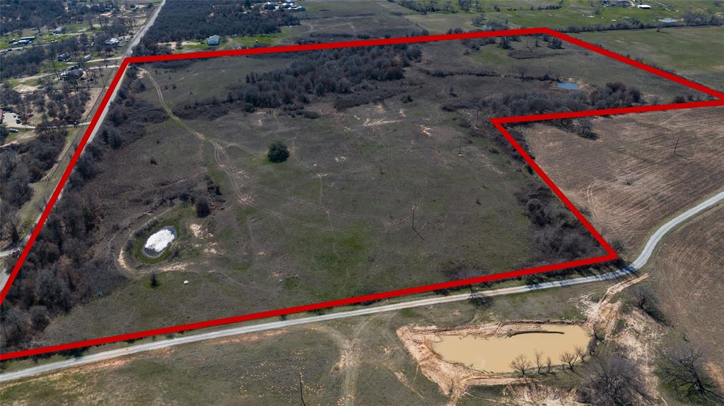 SELLERS MOTIVATED!   Here's your opportunity to own nearly 40 acres of land with endless potential!   Ideal for investors, builders, or commercial developers!  This expansive property has excellent road frontage and convenient access to major highways and thoroughfares.  Features co-op water, two rain-fed tanks, barbed wire fencing and coastal bermuda. Don’t miss out on this rare chance to secure a large tract of land in a strategic location.  Whether you're looking to develop a residential community, commercial project, or hold as a long-term investment, this property provides a blank canvas for your vision.  Bring Your Offers!