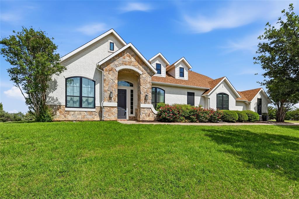 **NEW & IMPROVED PRICE** Welcome to the exclusive, gated community of Lago Vista at Bonds Ranch where space, style, and value come together in one exceptional opportunity. Situated on one of the largest lots in the neighborhood, this impressive home features one of the most expansive floorplans available and is priced below market value—making it a rare find you won’t want to miss! Designed for both comfort and functionality, the home offers 5 spacious bedrooms, with 4 conveniently located on the main level, including a private primary retreat. Multiple living and dining areas provide flexibility for everyday living and entertaining, while a cozy, wood-burning fireplace anchors one of the living rooms, perfect for relaxing evenings at home. Upstairs, you’ll find a media room ideal for movie nights or game days. Storage is abundant throughout, highlighted by a show-stopping walk-in closet in the primary suite along with a large additional storage room upstairs. Recent upgrades include sleek black-framed windows that enhance the home’s modern appeal, along with granite countertops and quality finishes throughout. Step outside to a covered back porch overlooking a beautifully maintained lawn—ideal for entertaining or unwinding. Located in highly sought-after Eagle Mountain-Saginaw ISD, this home feeds into the new, state of the art Eagle Mountain High School and is just minutes from Eagle Mountain Lake for boating, fishing, and outdoor fun.