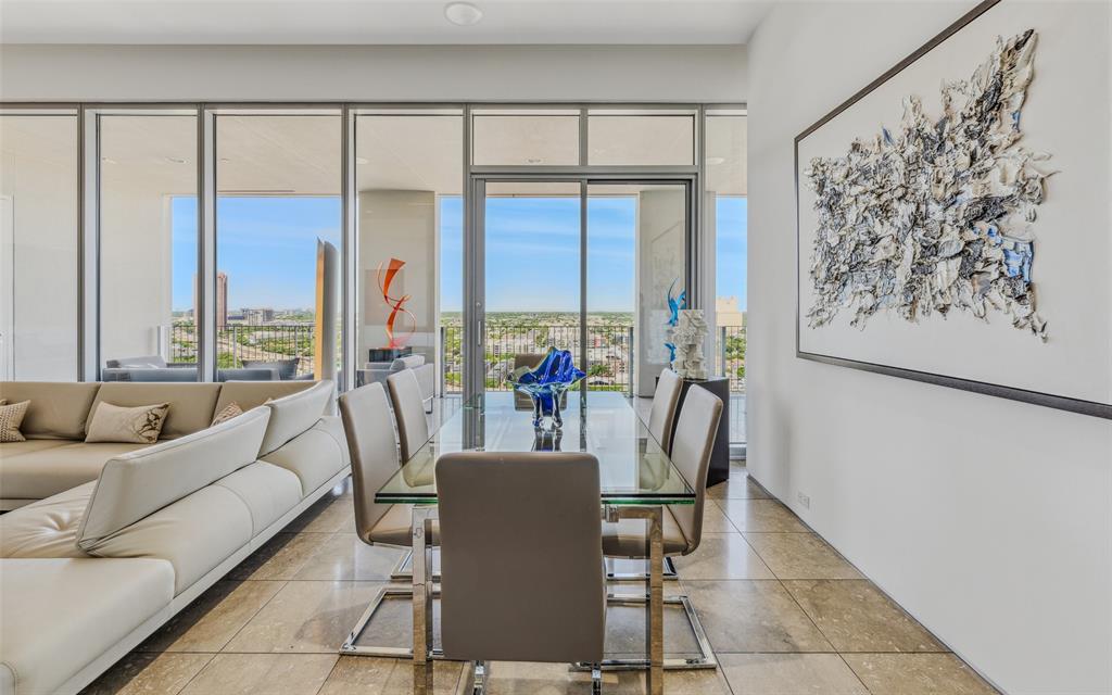Experience luxury urban living at One Arts Plaza in the heart of the award-winning Dallas Arts District. This contemporary condo is filled with natural light and offers an open-concept floor plan ideal for both everyday living and entertaining. The spacious kitchen features an oversized breakfast bar and flows seamlessly into the living and dining areas. A large covered balcony, accessible from the kitchen, living room, and primary suite, creates exceptional indoor-outdoor living space. The primary retreat includes a spa-inspired bath and generous walk-in closet. A versatile second bedroom features a built-in workspace and Murphy bed, making it ideal for guests or a home office. Enjoy a true lock-and-leave lifestyle within walking distance of the Winspear Opera House, Meyerson Symphony Center, Klyde Warren Park, premier dining, and the best of Downtown Dallas. A rare opportunity to own a sophisticated residence in one of Dallas' most vibrant and walkable neighborhoods.