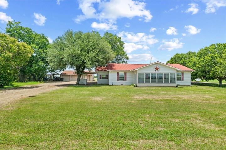 Escape the Hustle & Find Your Own Little Slice of Country Heaven! If you’ve been dreaming of WIDE OPEN SPACES and room to breathe, this charming 3-BEDROOM, 1-BATH COUNTRY RETREAT is calling your name. Nestled on a CORNER LOT WITH NEARLY 2 ACRES of mature trees and lush yard space, this property sits OUTSIDE CITY LIMITS - meaning NO CITY TAXES and NO HOA telling you what to do with your land. Start your mornings with BREATHTAKING SUNRISES and wind down with STUNNING SUNSETS, all from the comfort of your own private piece of Ellis County. The ENCLOSED FRONT PORCH is the perfect spot to soak it all in. With plenty of yard for OUTDOOR LIVING, GARDENING, ANIMALS, and room to roam, this one checks every box for the country lifestyle you’ve been craving. The OVERSIZED DETACHED 2-CAR GARAGE features a WORKSHOP WITH ELECTRICITY — ideal for the hobbyist, mechanic, or craftsman. Need to store your RV or toys? The OVERSIZED COVERED RV PARKING has you covered. Even better, a SECOND WATER METER AND SEPTIC SYSTEM are already in place, making this property perfectly set up for a SECOND RESIDENCE or the ultimate FAMILY COMPOUND. All of this with EASY ACCESS TO I-35, so you get the peace of country living without sacrificing convenience. NO WAXAHACHIE TRAFFIC. NO CITY TAXES. NO HOA. Just wide open spaces, endless potential, and a property that truly has it all. BRING THE FAMILY. BRING THE ANIMALS. BRING YOUR VISION. THIS ONE WON’T LAST LONG.